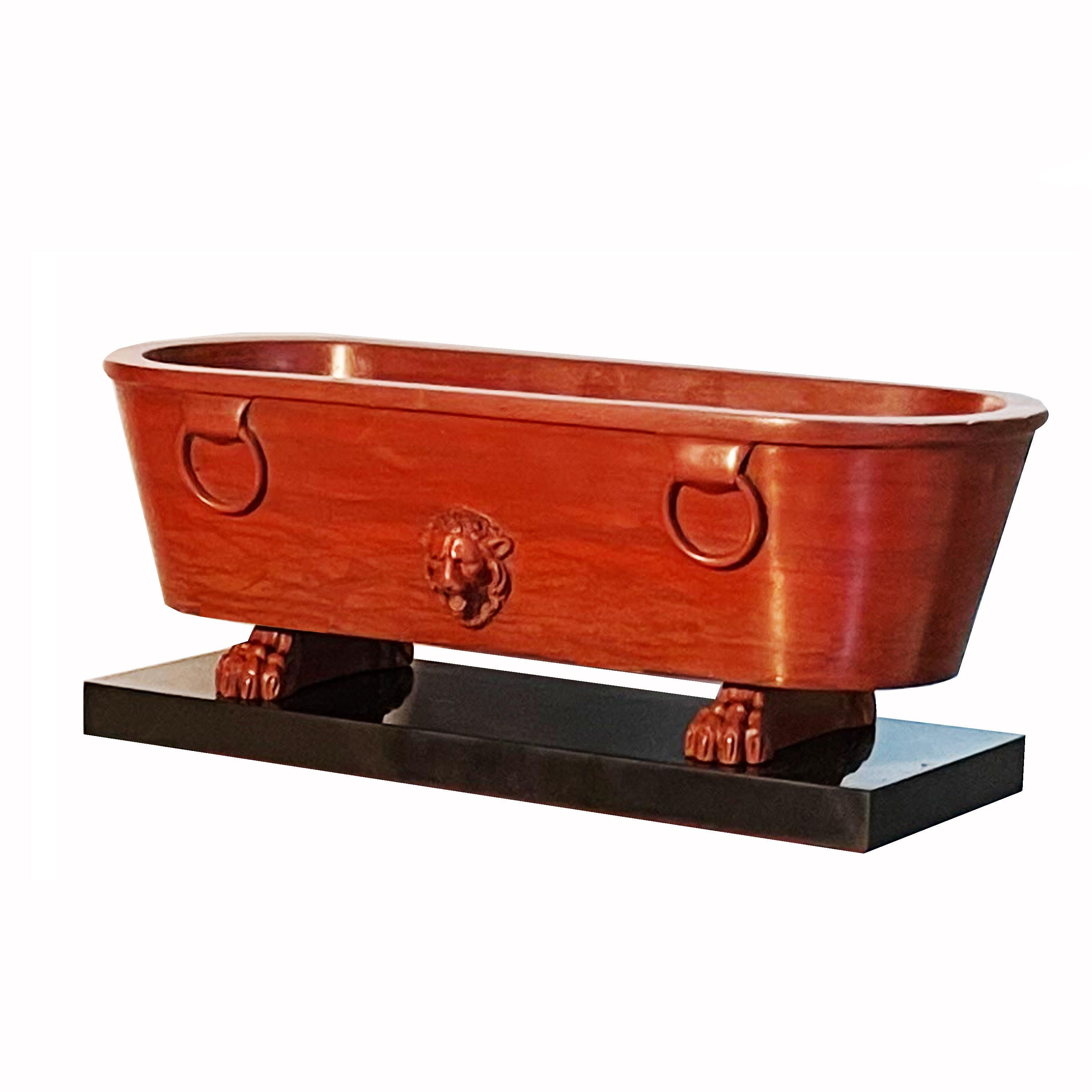 This incredible basin was inspired by the twin fountains of Piazza Farnese, in Rome ( Roman basins of Egyptian granite ) 
It was made by excavating a block of ancient Rosso antico marble. Rosso antico was widely used throughout the Roman empire