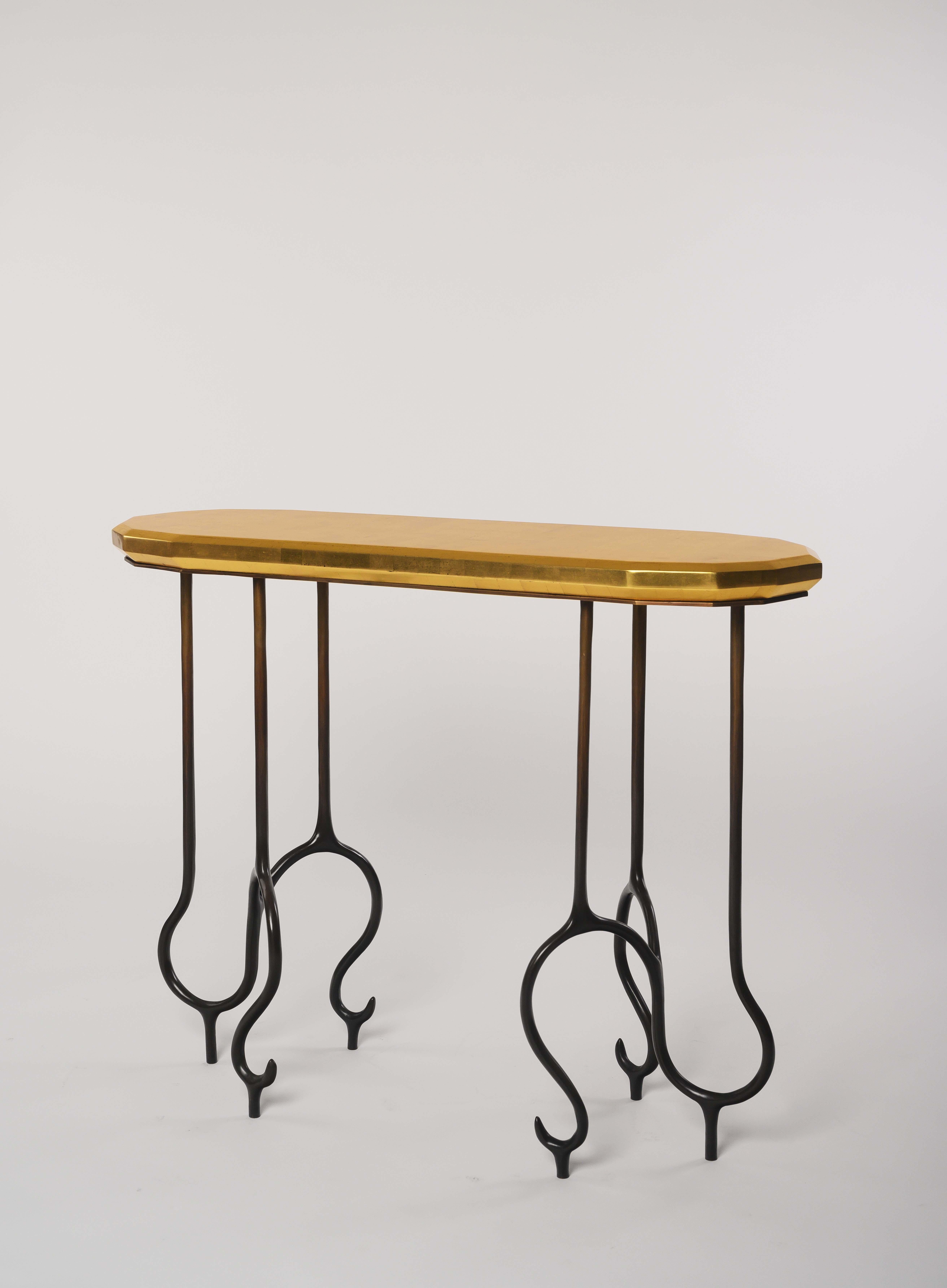 Faroh Console in Cast Bronze and Gold Leaf by Elan Atelier

The Faroh console is a combination of distinctive cast bronze legs topped by a stunning solid wood gilt top. Custom sizes and finishes are available.

Dimensions/
w 39.4 x d 11.8 x h 30.5