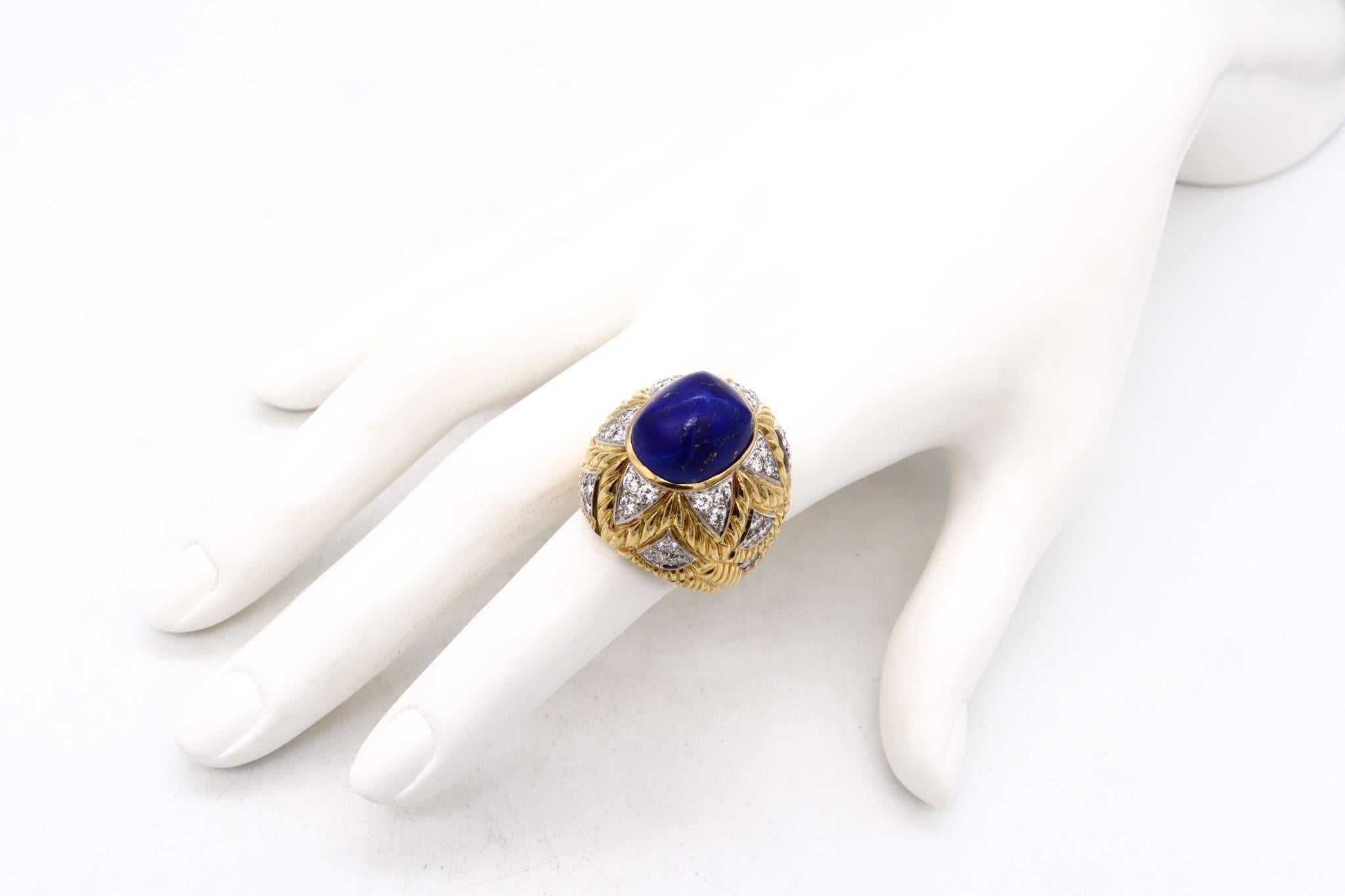Italian designer cocktail ring with gemstones.

A gorgeous jewelry piece from the Italian mid-century period, circa 1960. This bold oversized cocktail ring has been crafted in solid 18 karats yellow gold with texturized surfaces and white gold