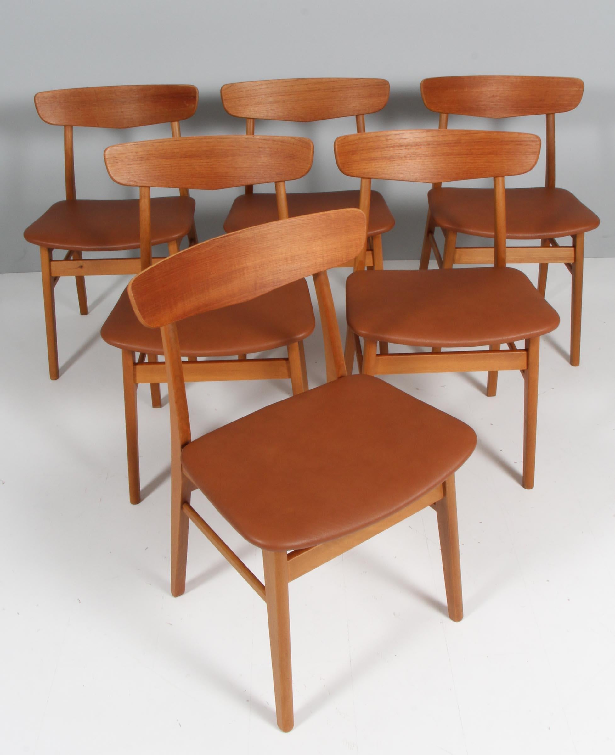 Farstrup set of six dining chairs with frame of solid beech, backrest of veenered teak.

Upholstered with cognac aniline leather.

Made by Farstrup.