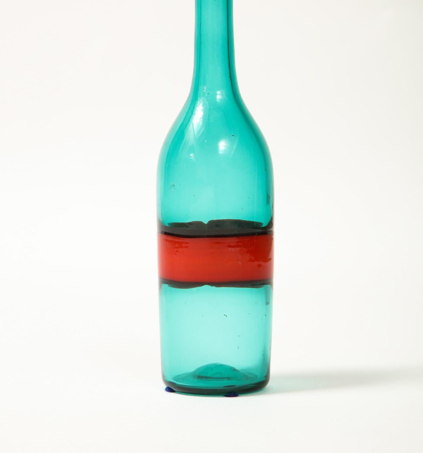Hand blown incalmo glass decanter in red and green with stopper. Unsigned. Bottle top appears to have been neatly ground down at some point. Provenance: Private collection, Berkeley, CA.