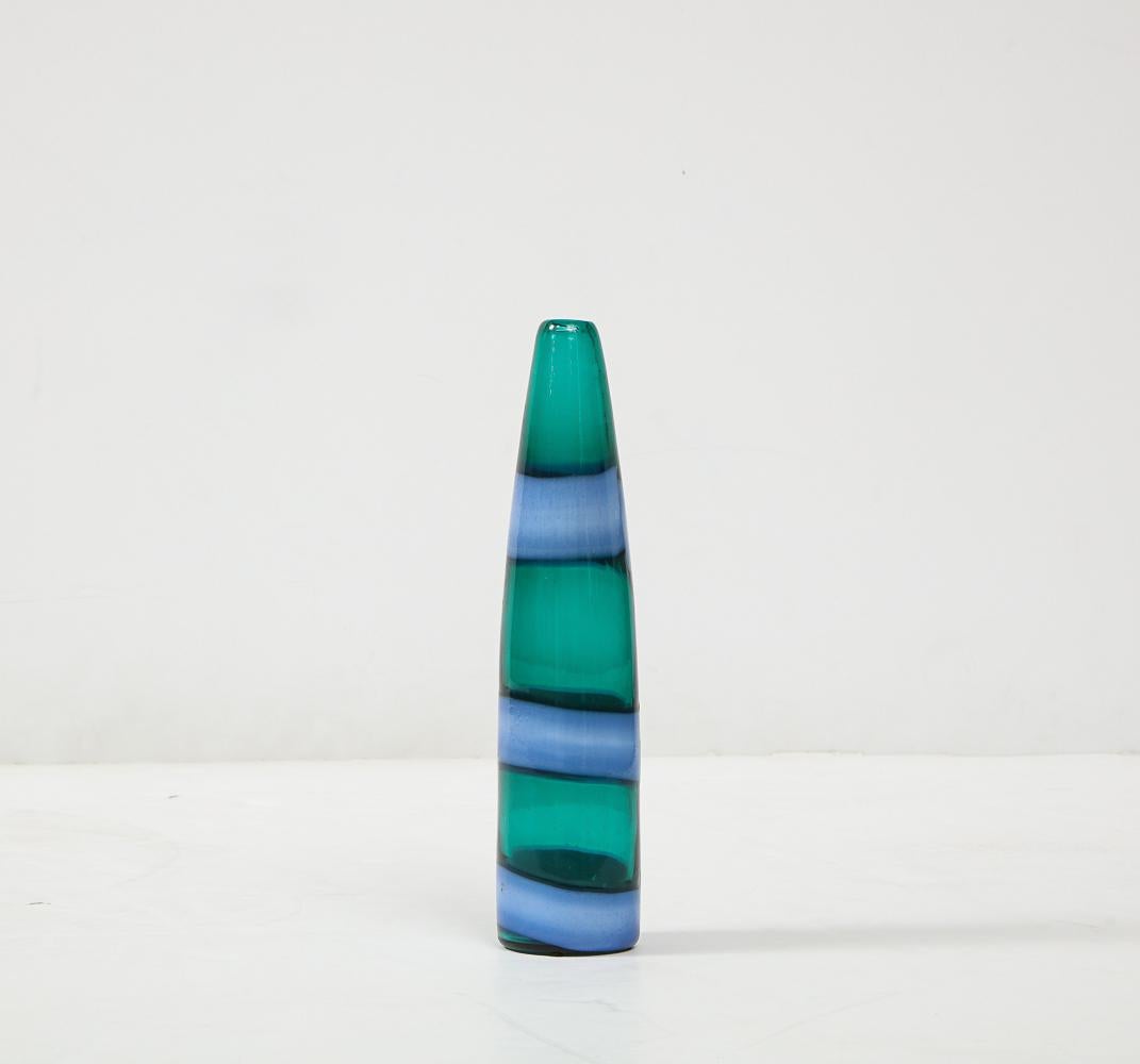 Hand blown, incalmo glass bottle in green and blue. Venini label attached to bottom.