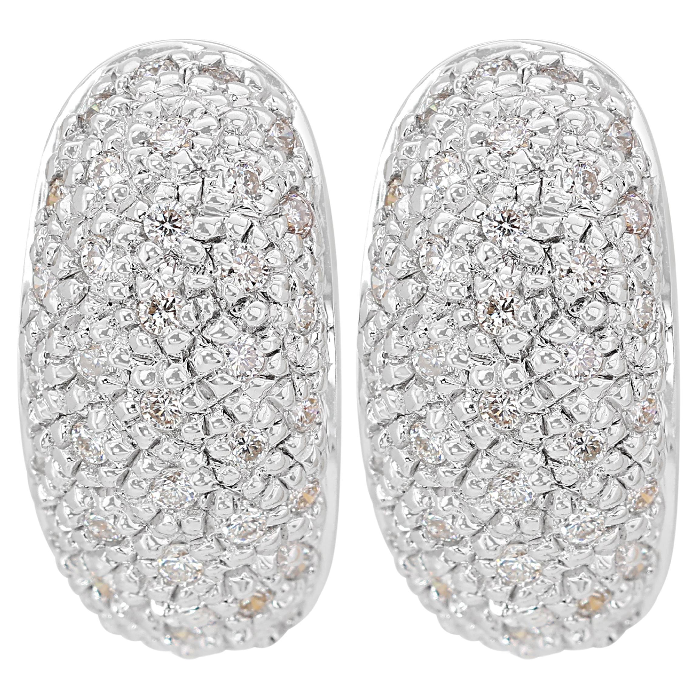 Boucles d'oreilles en or blanc 18 carats avec un diamant de 0,40 ct.