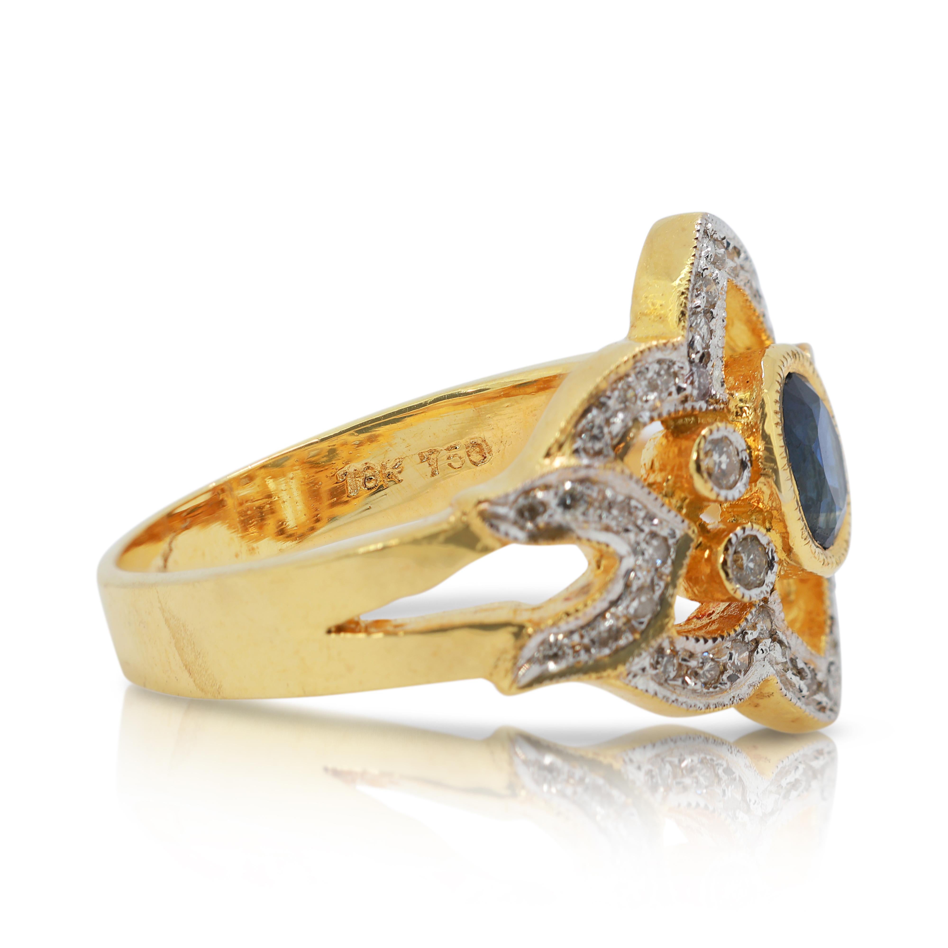 Taille ovale Fascinante bague en or jaune 18 carats avec saphir bleu de 0,43 carat et diamants en vente