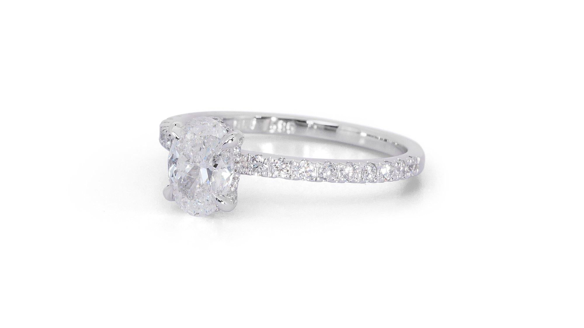 Fascinating 1.27ct Diamond Pave Ring in 18k White Gold - GIA Certified

Experience the epitome of elegance with this stunning 18k white gold pave ring, featuring a 1.01-carat oval-shaped diamond as its main stone. Complementing the oval diamond are