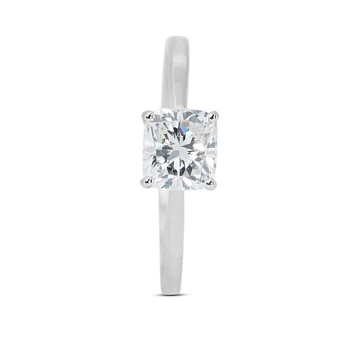 Fascinating 18K White Gold Ideal Cut Natural Diamond Solitaire Ring w/1.00ct 

Crafted in gleaming 18K white gold, this ring exudes modern elegance and sophistication. The white gold metal perfectly complements the diamond's brilliance. This