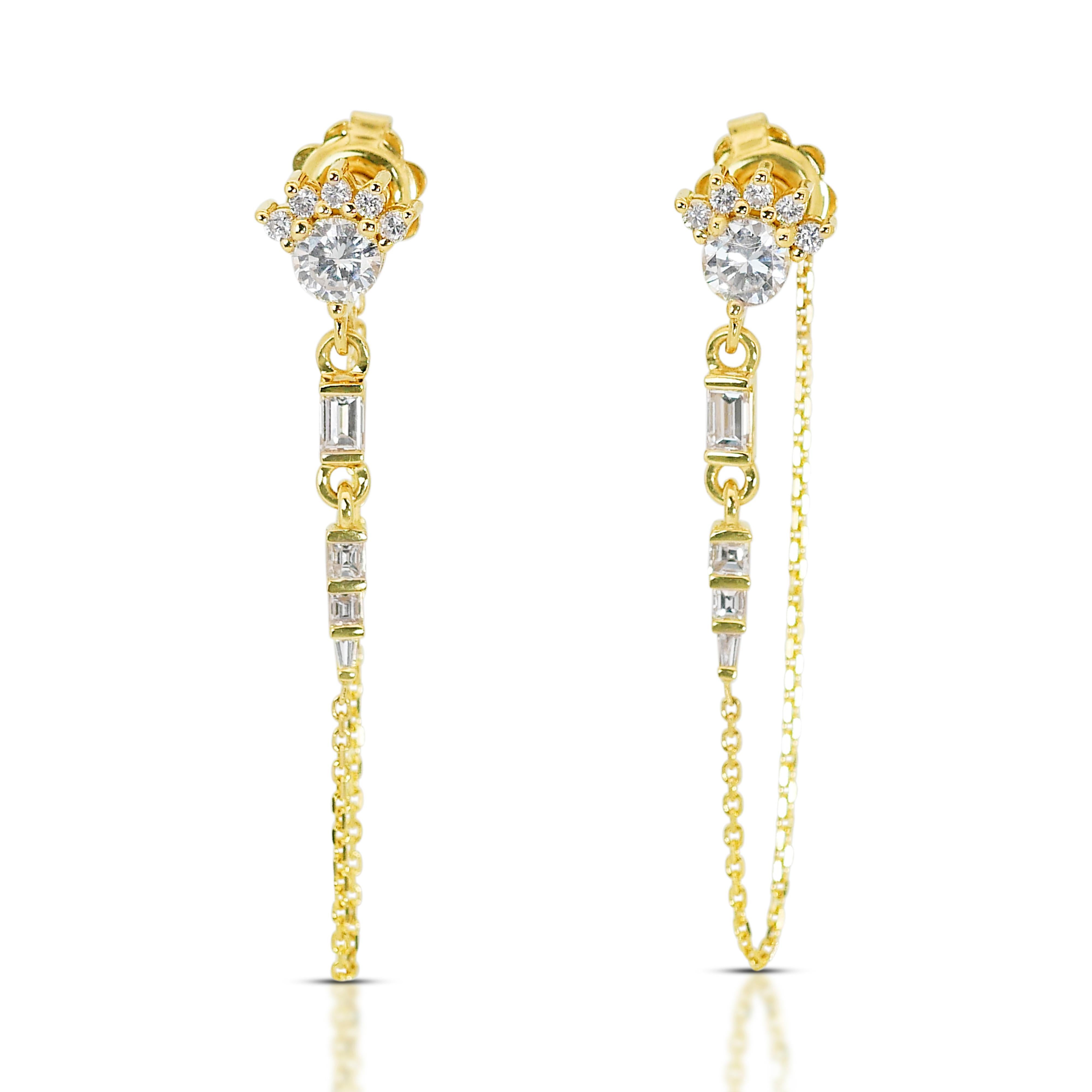 Adorn yourself with this fascinating pair of diamond drop earrings. This 18k yellow gold diamond earrings is accompanied by an IGI Certification, a testament to their exceptional quality and authenticity. Each earrings is adorned with additional