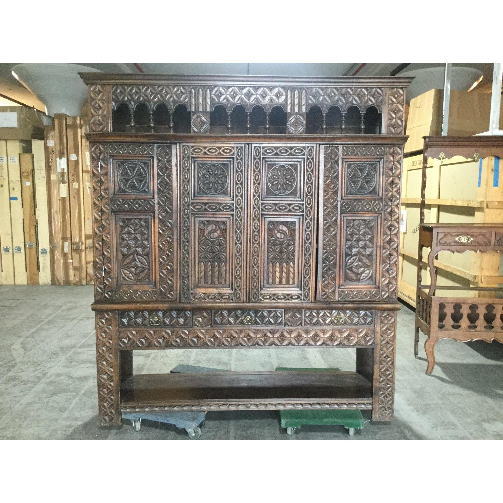 Very unusual regional piece from Brittany known as a lit-clos, this piece originated as a recessed bed, covering the outer wall in a typical 19th century farmhouse. Made of chestnut, there are carvings on all front doors, as well as around the
