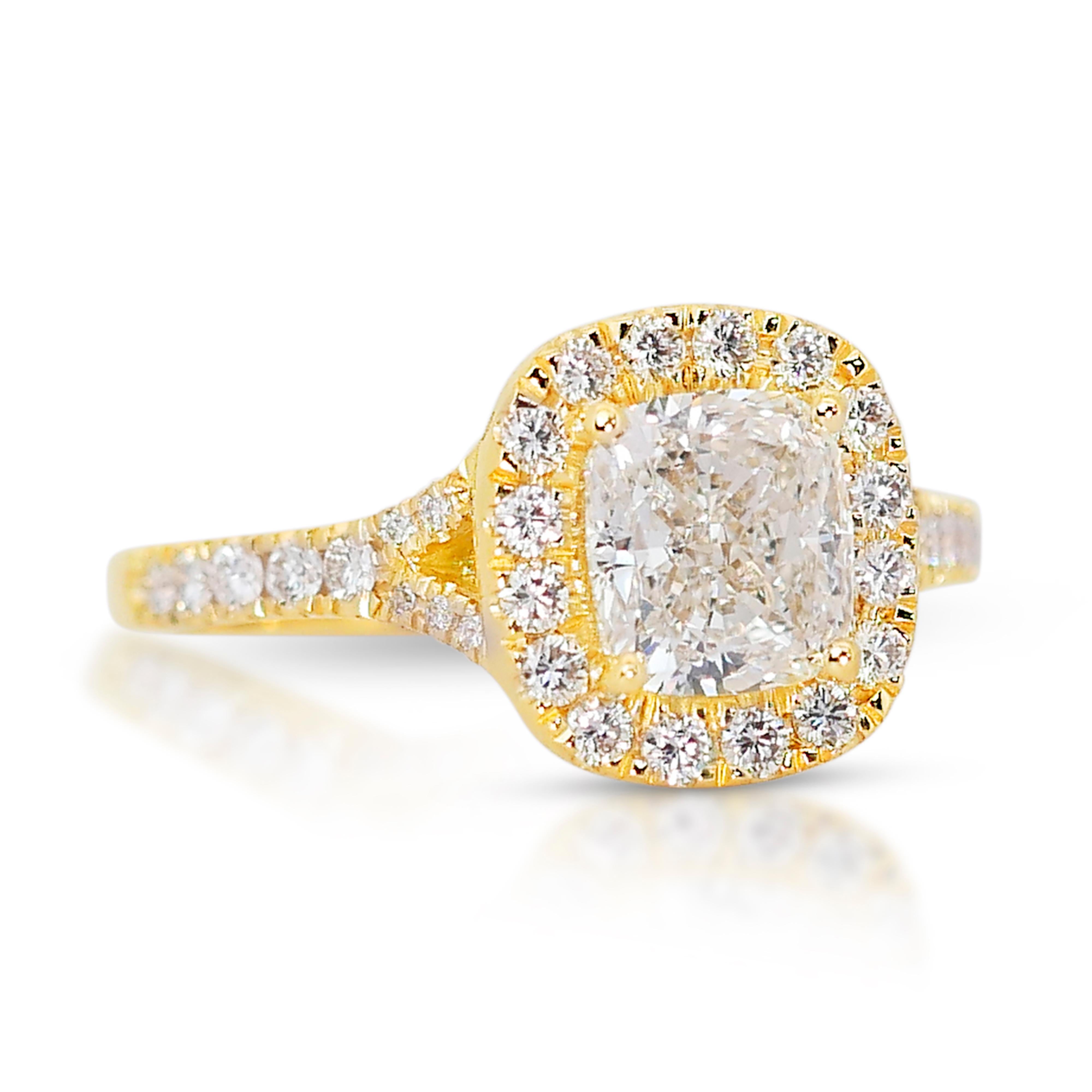 Fascinating 2.02ct Diamonds Halo Ring in 18k Yellow Gold - IGI Certified

Celebrate timeless elegance with this stunning cushion-cut diamond halo ring, masterfully crafted from 18k yellow gold. The centerpiece is a magnificent 1.51-carat diamond,