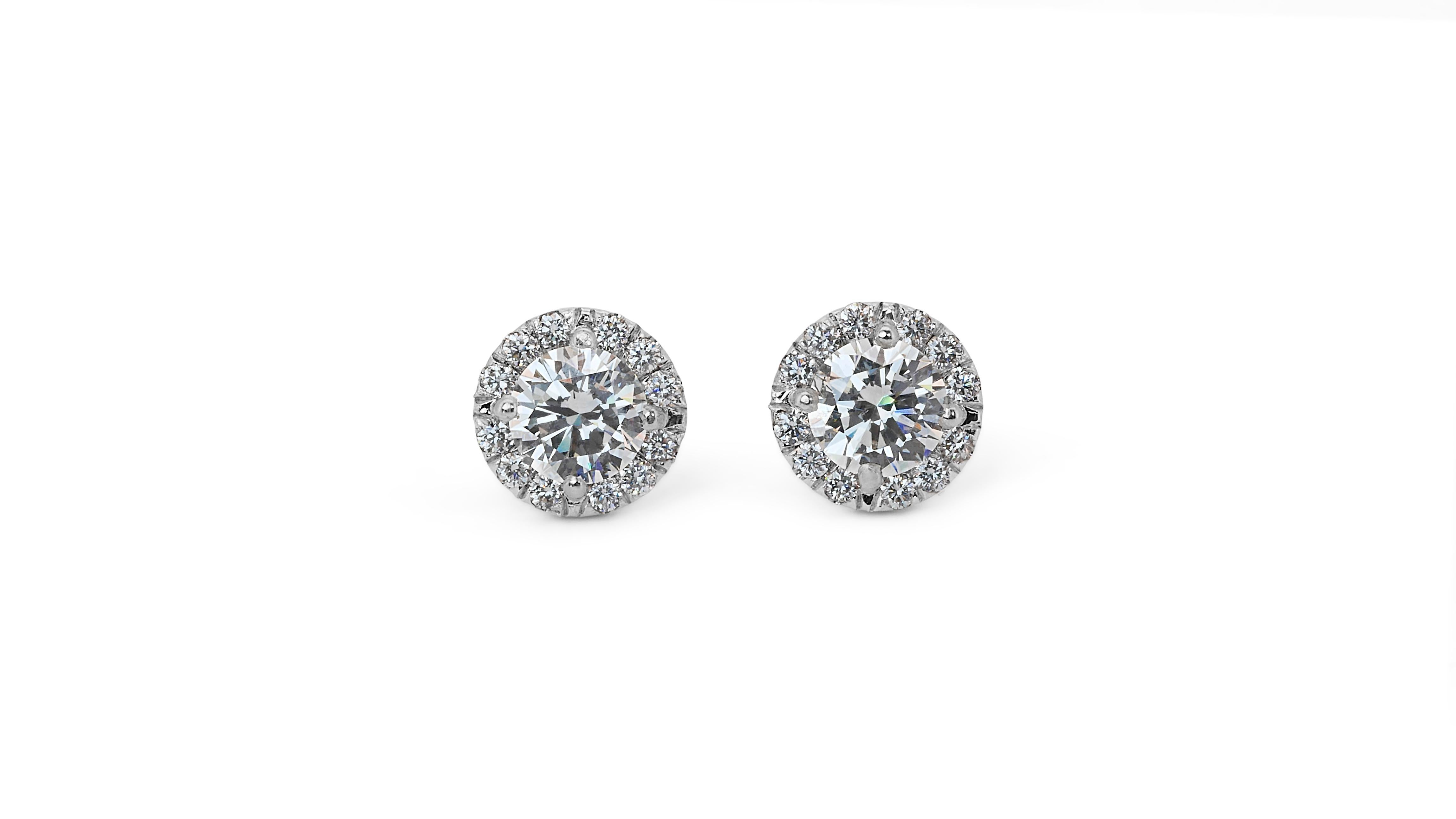 Fascinating 2.55ct Diamond Halo Earrings in 18k White Gold - GIA Certified

Step into the spotlight with these luxurious diamond halo earrings, meticulously crafted from 18k white gold. Featuring two central round brilliant diamonds, with a combined