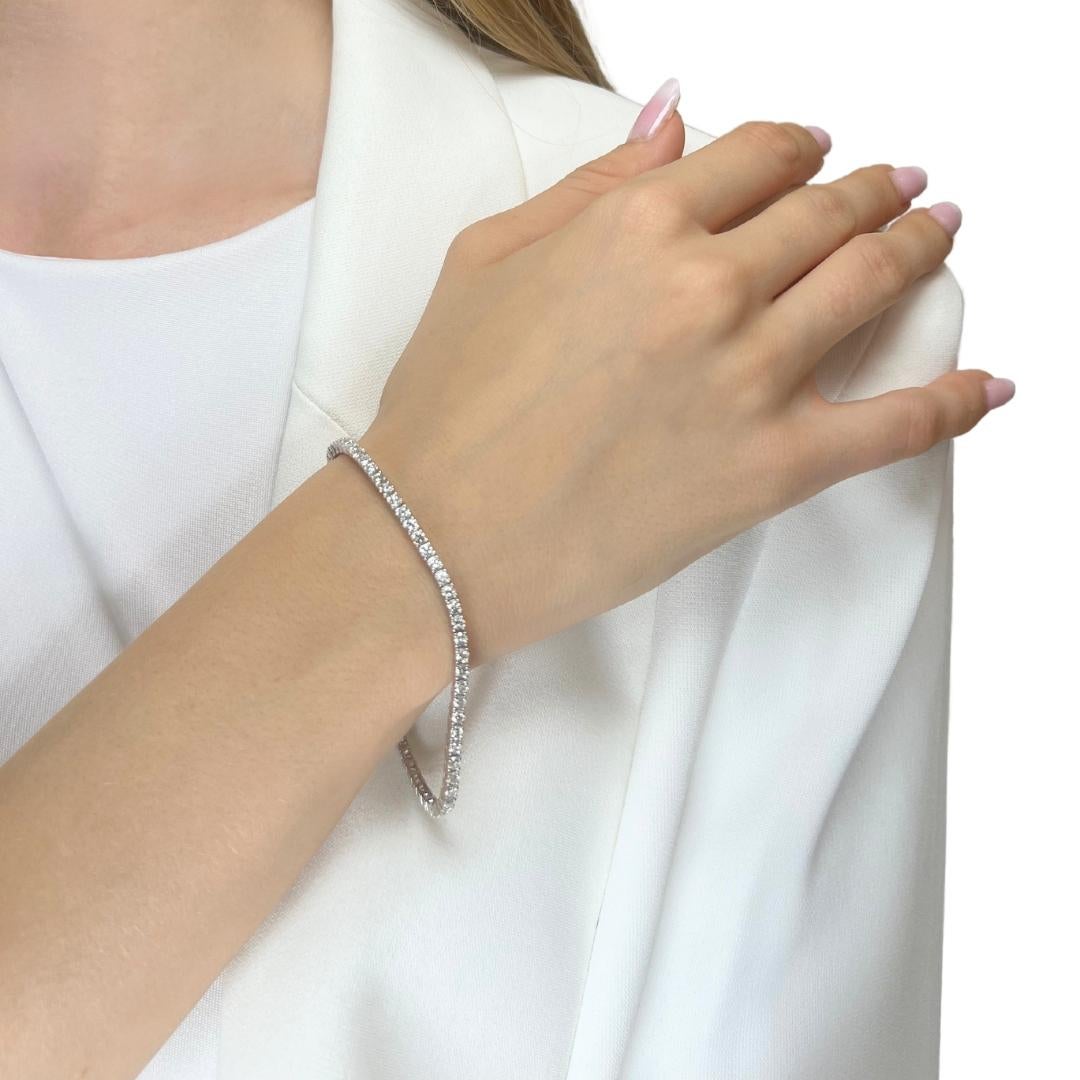 This luxurious 18k white gold tennis bracelet features 66 dazzling round diamonds, totaling an impressive 3.86-carat. This bracelet is the epitome of elegance and sophistication, perfect for adding a touch of glamour to any occasion. Certified by