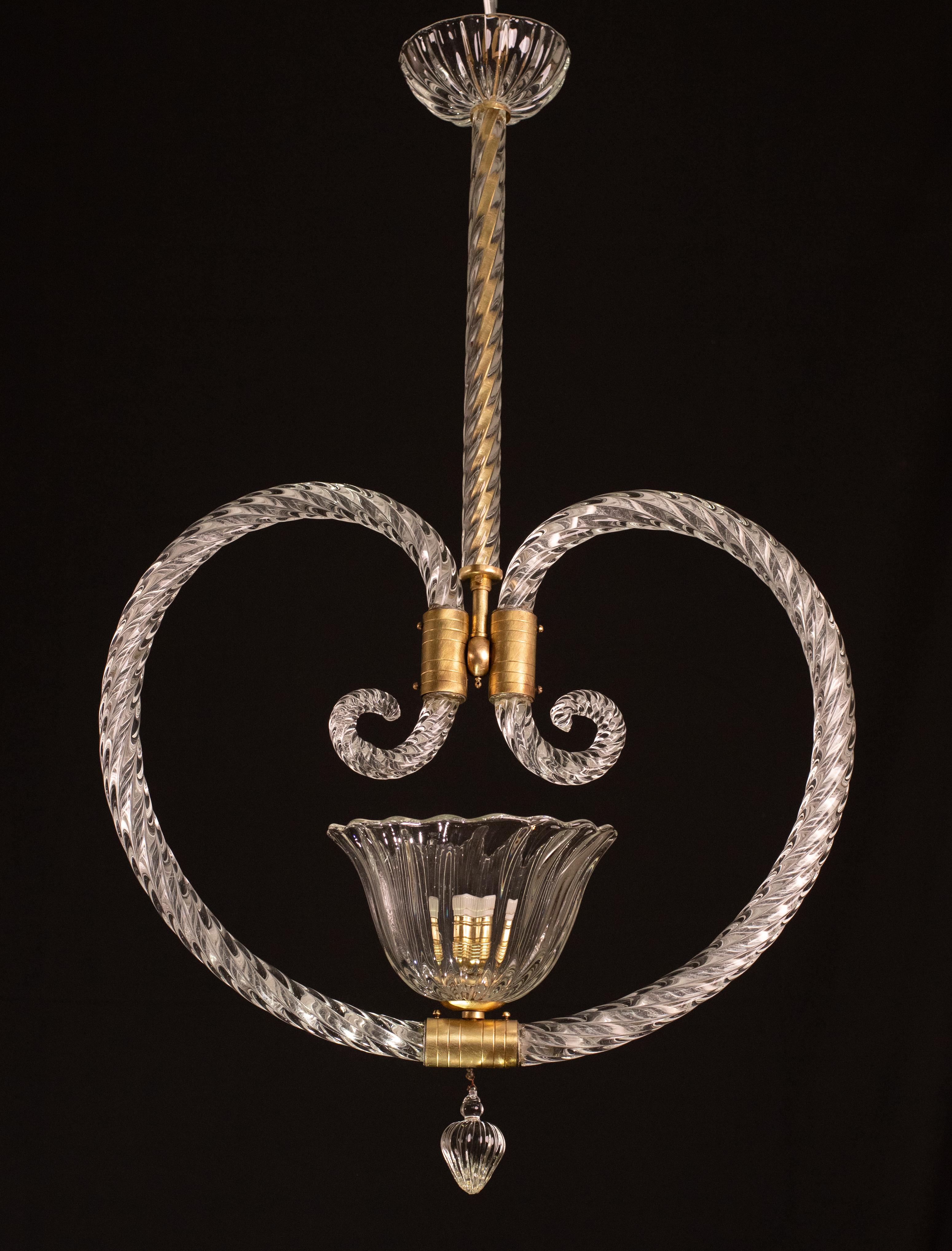 Splendid Art Deco chandelier attribuited to Ercole Barovier made by the glassworks Barovier & Toso in the 1940s-1950s, with the shape of Hearth.
The chandelier is 85 cm high and measures 50 cm wide.
The glass elements make this pendant extremely
