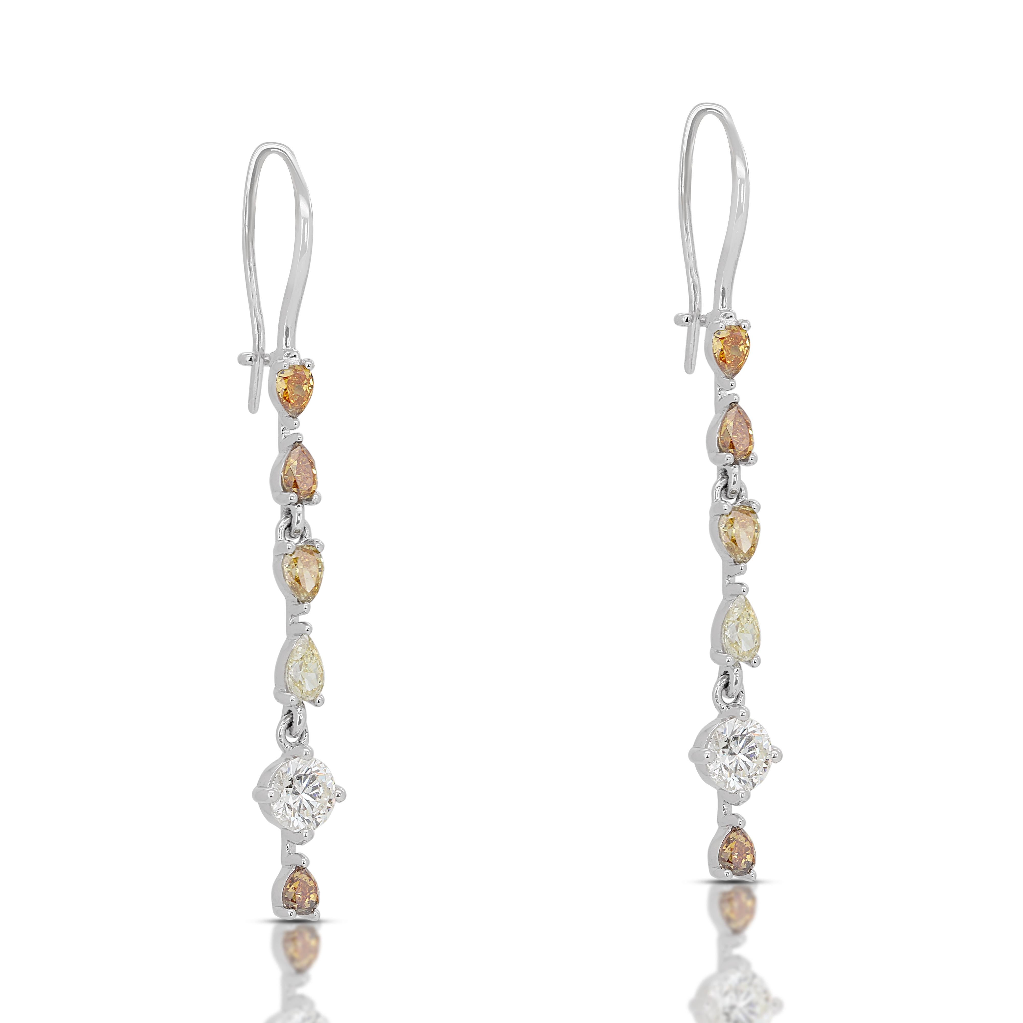 Fascinating Fancy Colored Diamond Drop Earrings w/2.62 ct - IGI Certified 

These captivating diamond drop earrings showcase a stunning combination of brilliance and vibrant color. Crafted in luxurious platinum, the earrings feature a total carat