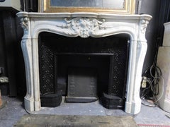Fascinating fireplace mantle in white Carrara marble, richly carved, France