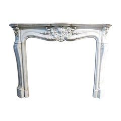 Fascinating fireplace mantle in white Carrara marble, richly carved, France