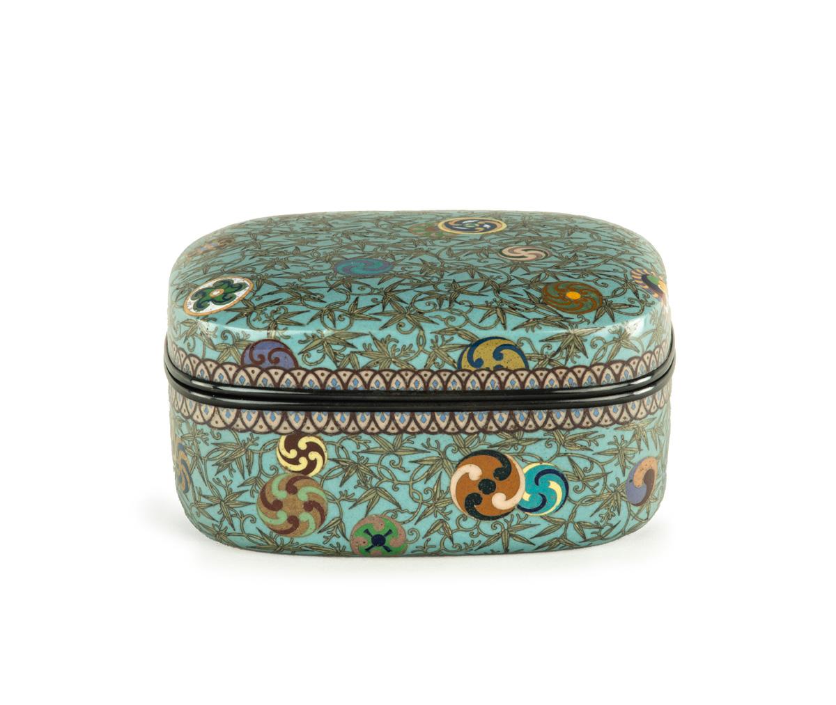 As part of our Japanese works of art collection we are delighted to offer this most unusual Meiji Period (1868-1912) cloisonne enamel lidded box, the cushion shaped box is fitted with shakudo rims and silk linings, the entire exterior is decorated