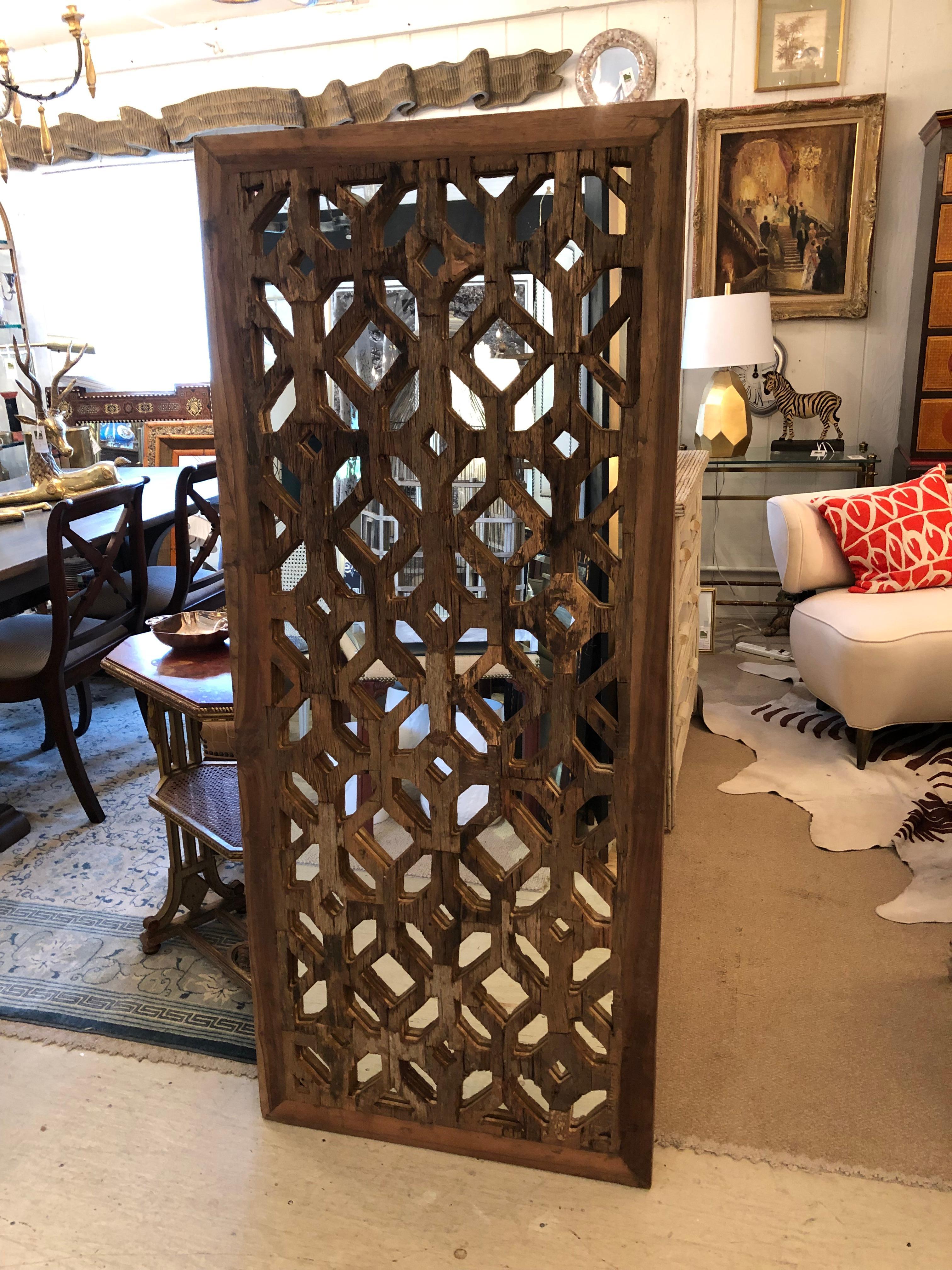 The Baladi mirror is an eye catching textural piece using reclaimed wood sourced in India as molds for cast marble window screens. The geometric shapes create a wonderful decorative pattern and feeling of India and far off lands.
