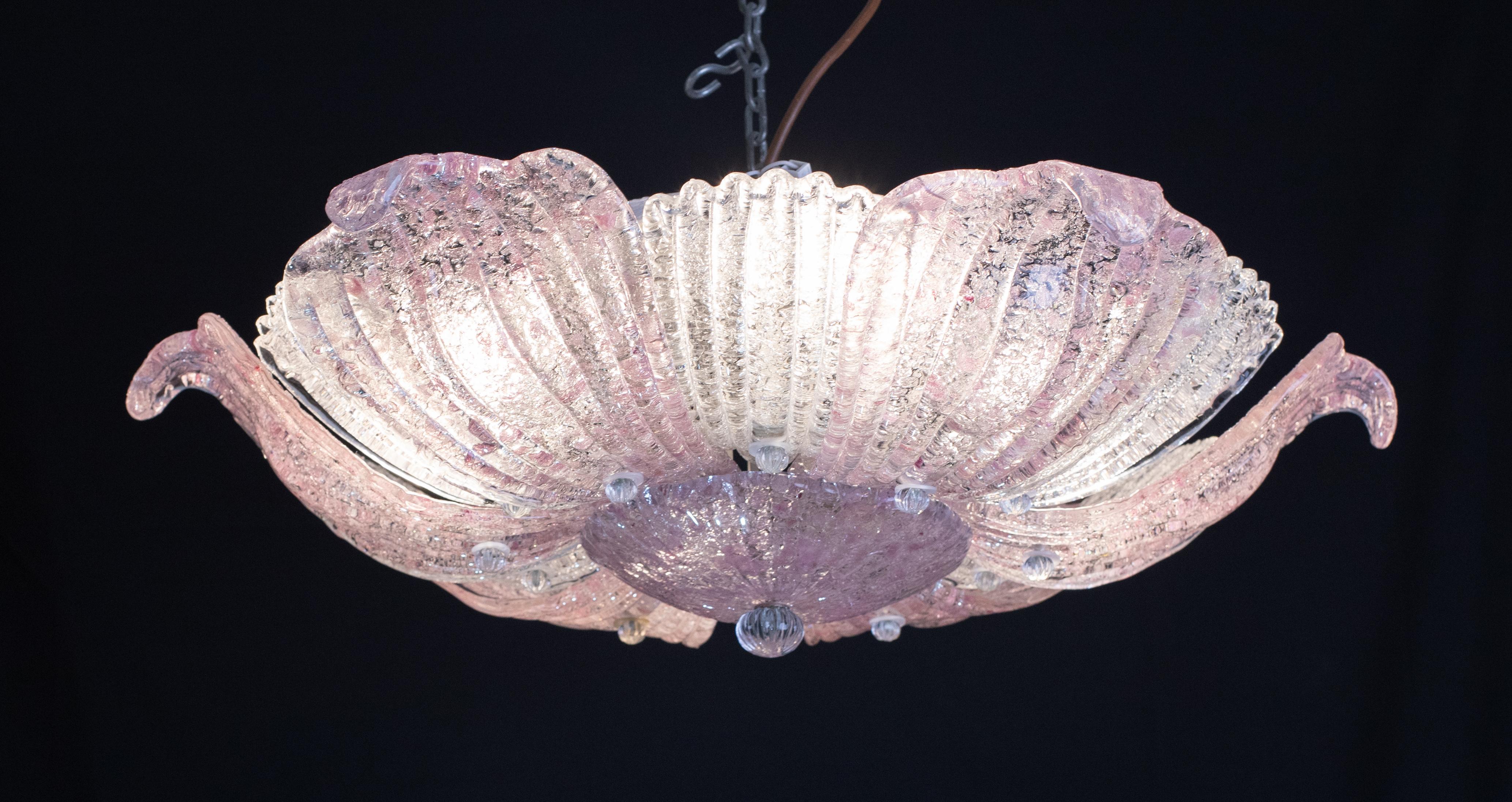 Elegant vintage Murano ceiling light with pink glass leaves from a historic Neapolitan pizzeria.

Period: circa 1970.

The ceiling light features 4 European standard E27 lights.

6 Pink Leaves, 6 Trasparent Leaves.

Excellent vintage condition.