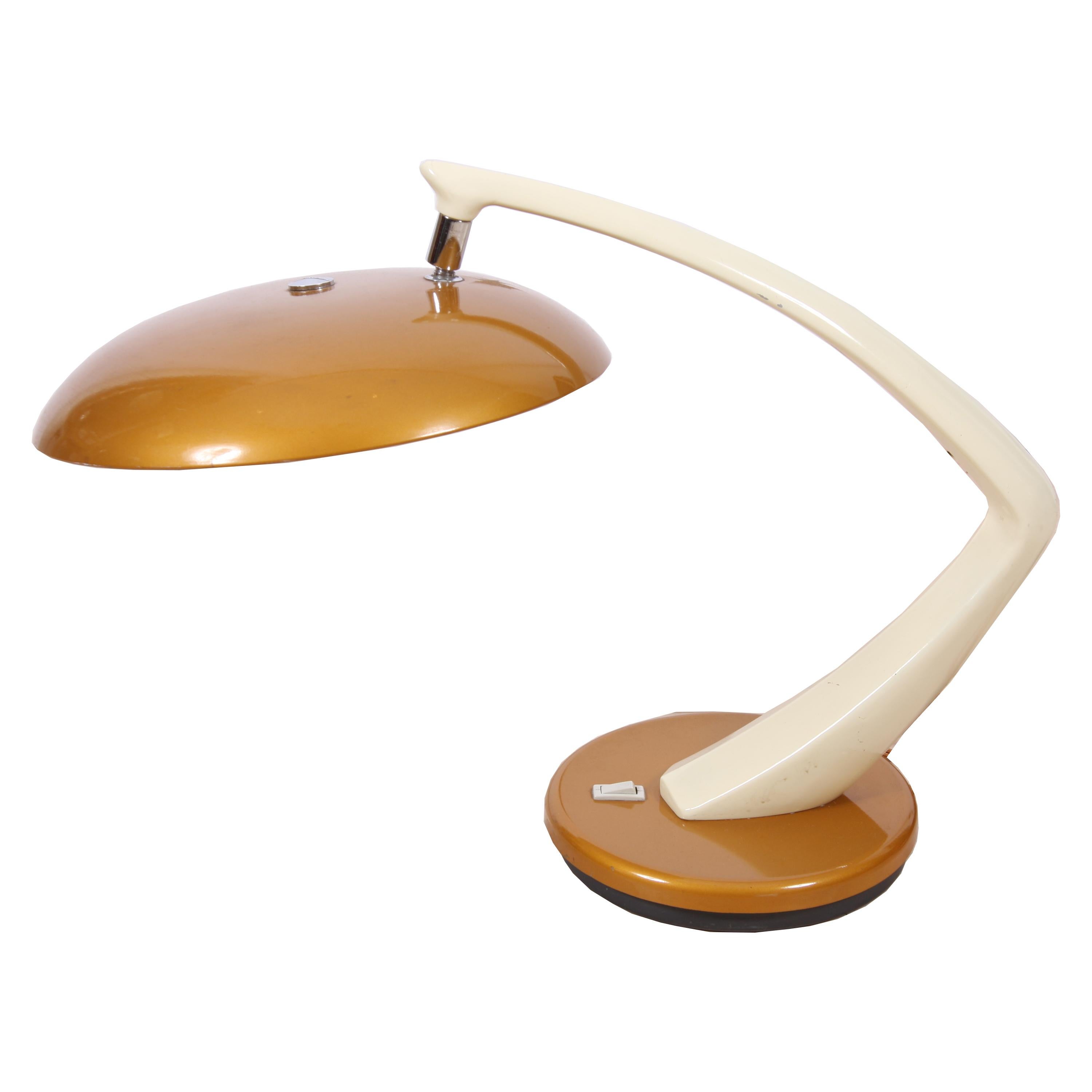 This desk lamp was made by FASE in Spain in the 1960s. It's an iconic design and this particular colour scheme is rare. 

The lamp has an adjustable shade and a rotating base. 

Rewired with rope twisted silk flex. 

FASE was established in
