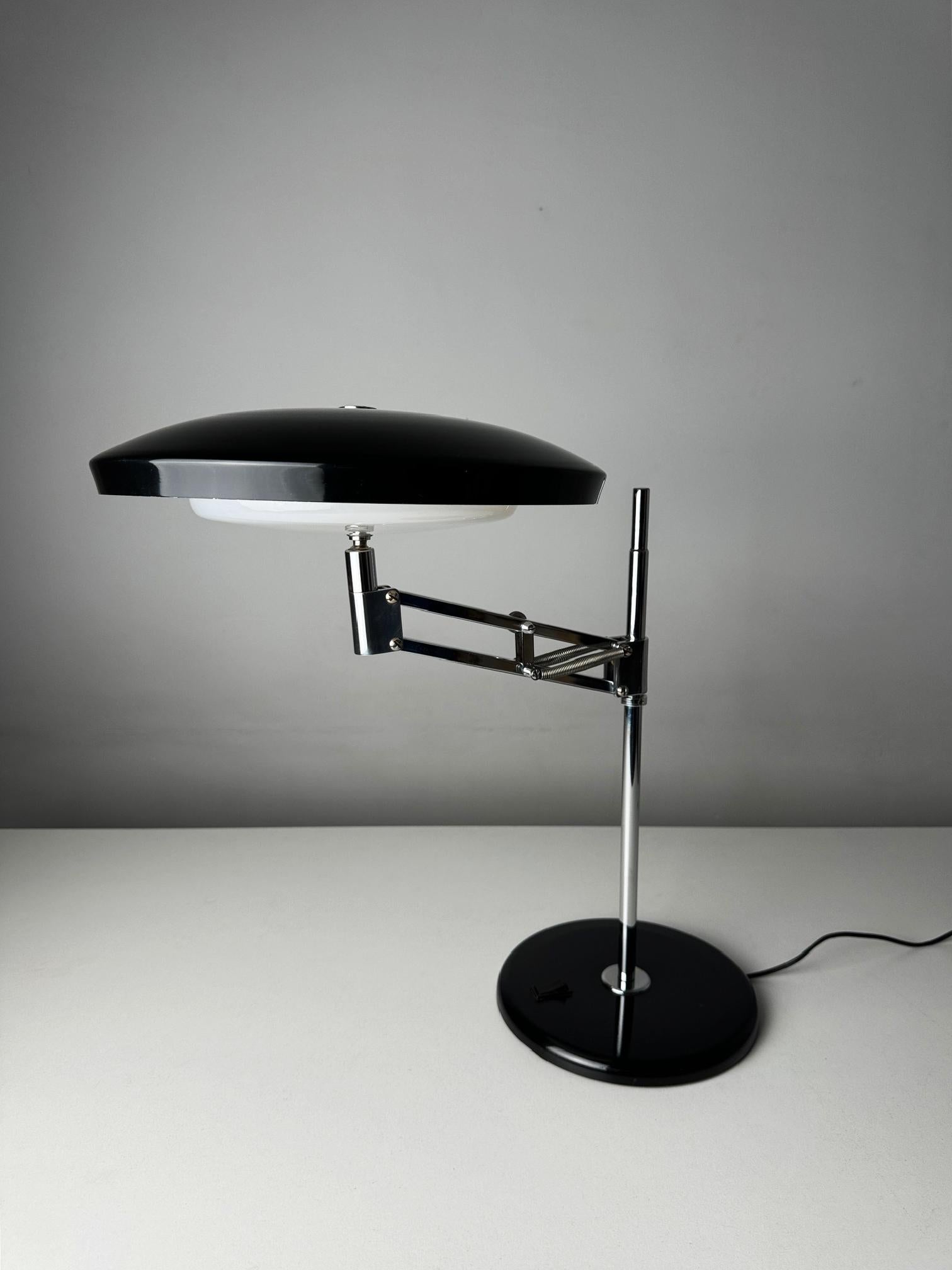 The Fase Consul 66 Table Lamp, designed by the renowned Luis Pérez de la Oliva, is a stunning example of mid-century modern design, celebrated for its timeless elegance and impeccable craftsmanship. Manufactured by the esteemed Spanish brand Fase,