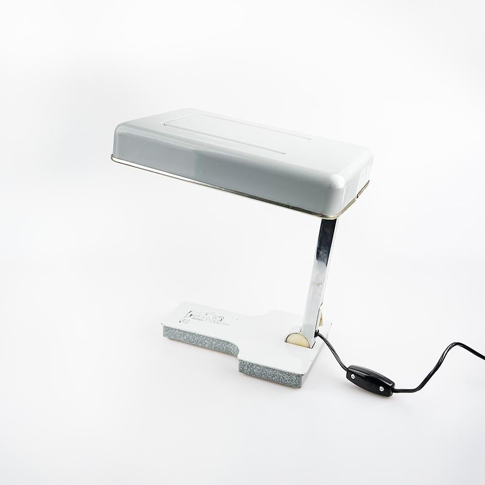 Fase Lamp Mini Fase Model, designed by Tomás Díaz Magro in 1969.

Gray lacquered metal lamp. Foldable until completely closed.

Some marks of use. At the base it has advertising for a cleaning company engraved. 