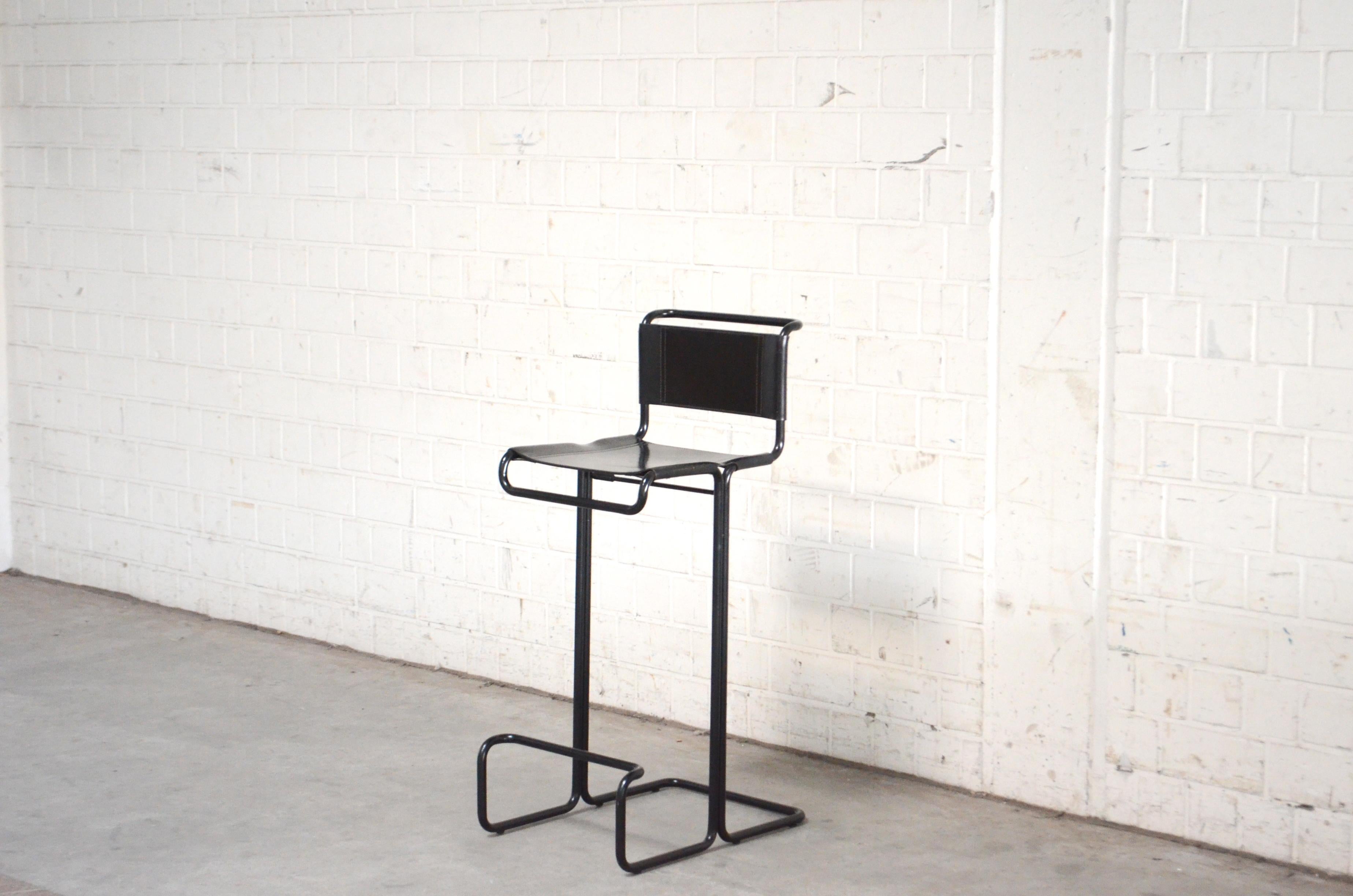 This Barstool was manufactured by Fasem in Italy.
It is a high cantilever chair with black tubesteel and saddle leather.