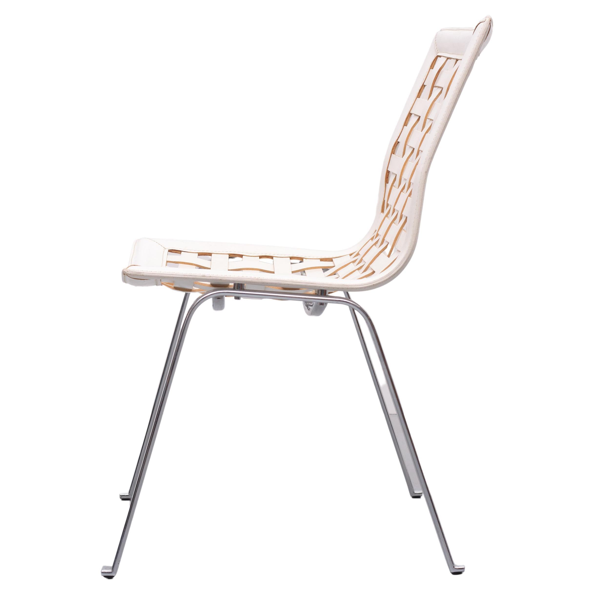 Sedia lounge italiana chiamata anche Net chair con struttura in acciaio cromato 
Seduta e schienale continui realizzati con strisce intrecciate di pelle pieno fiore. 
Colore bianco. Prodotto da Fasem Design Giancarlo Vegni anni '80 
Ottime
