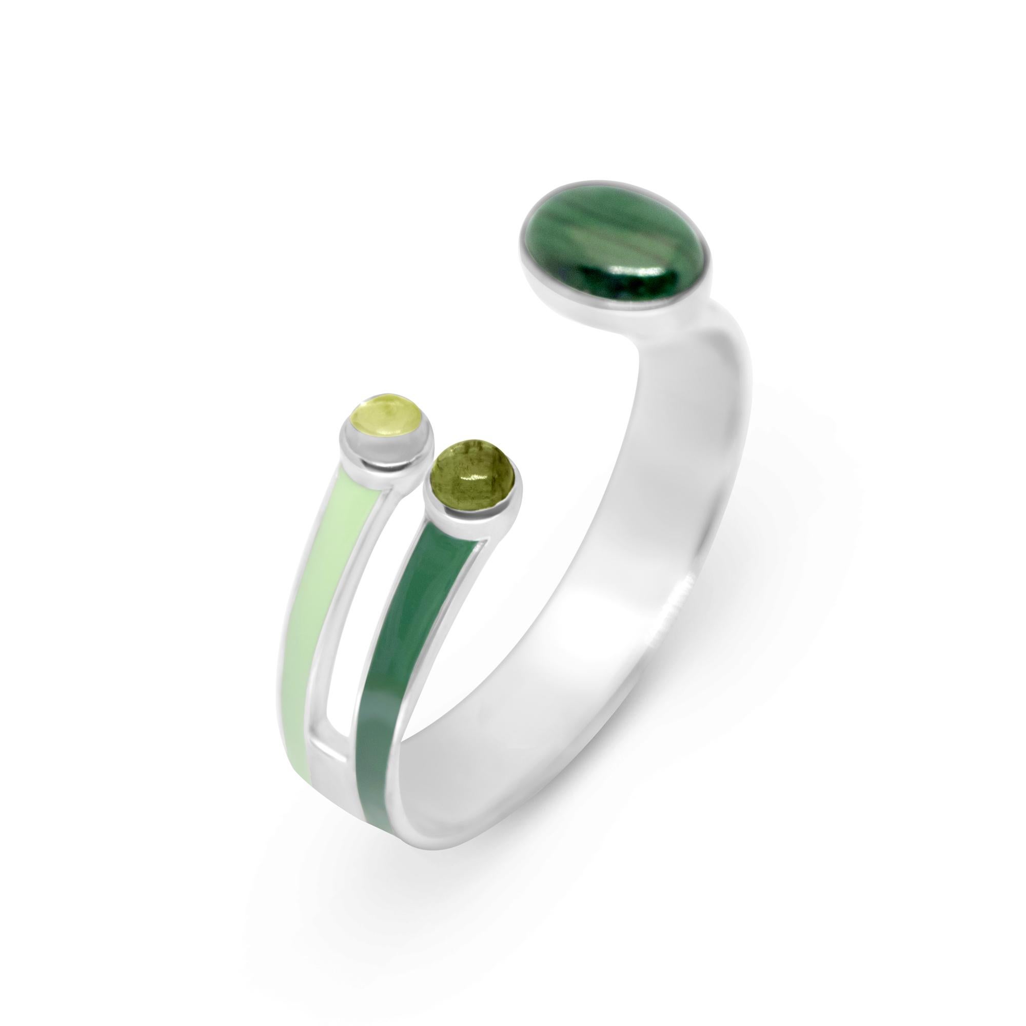 Cuff Bracelet in polished sterling silver and enamel, set with green tourmaline, peridot and malachite. The design is inspired by the stripe pattern and the color of nature, trees, specifically the Tuscan countryside, the designer's hometown. Green