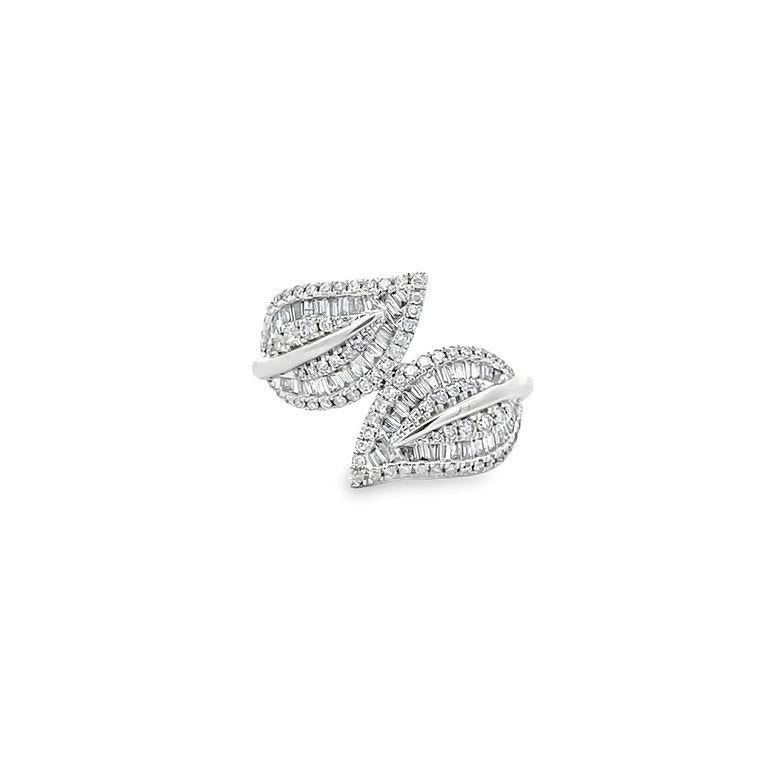 This exquisite fashion ring is a stunning example of masterful artistry and high-quality materials. The ring features a 14K white gold band with a beautiful leaf motif that adds a unique and eye-catching element to the design. The band is set with a