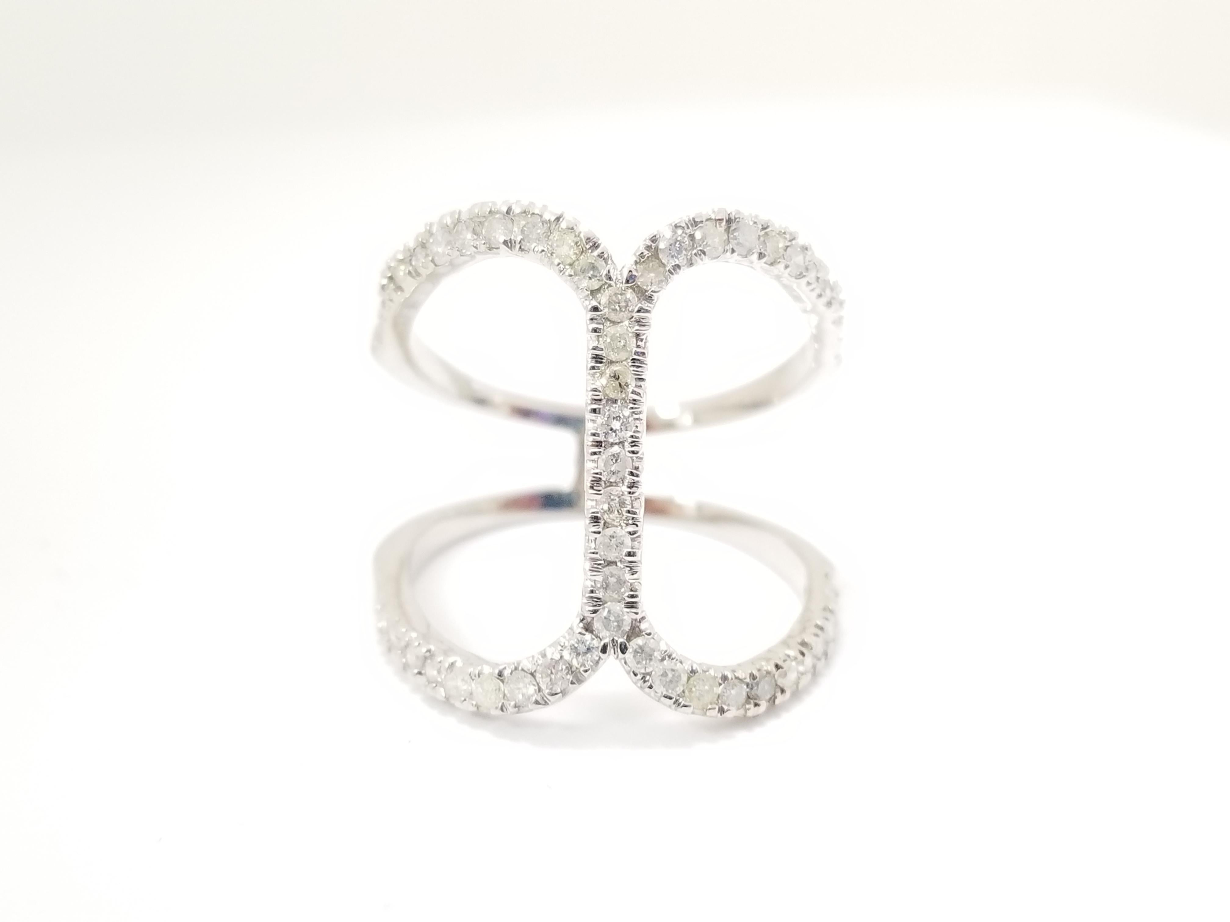 Brilliant prong-set round diamonds intersect each other in a cross design and look stunning. 
Crafted in 14k White gold, this ring exudes understated style and elegance.
Prong-Set Diamond Cross Ring 0.55 cttw
Average Color/Clarity I Color SI-I. Ring