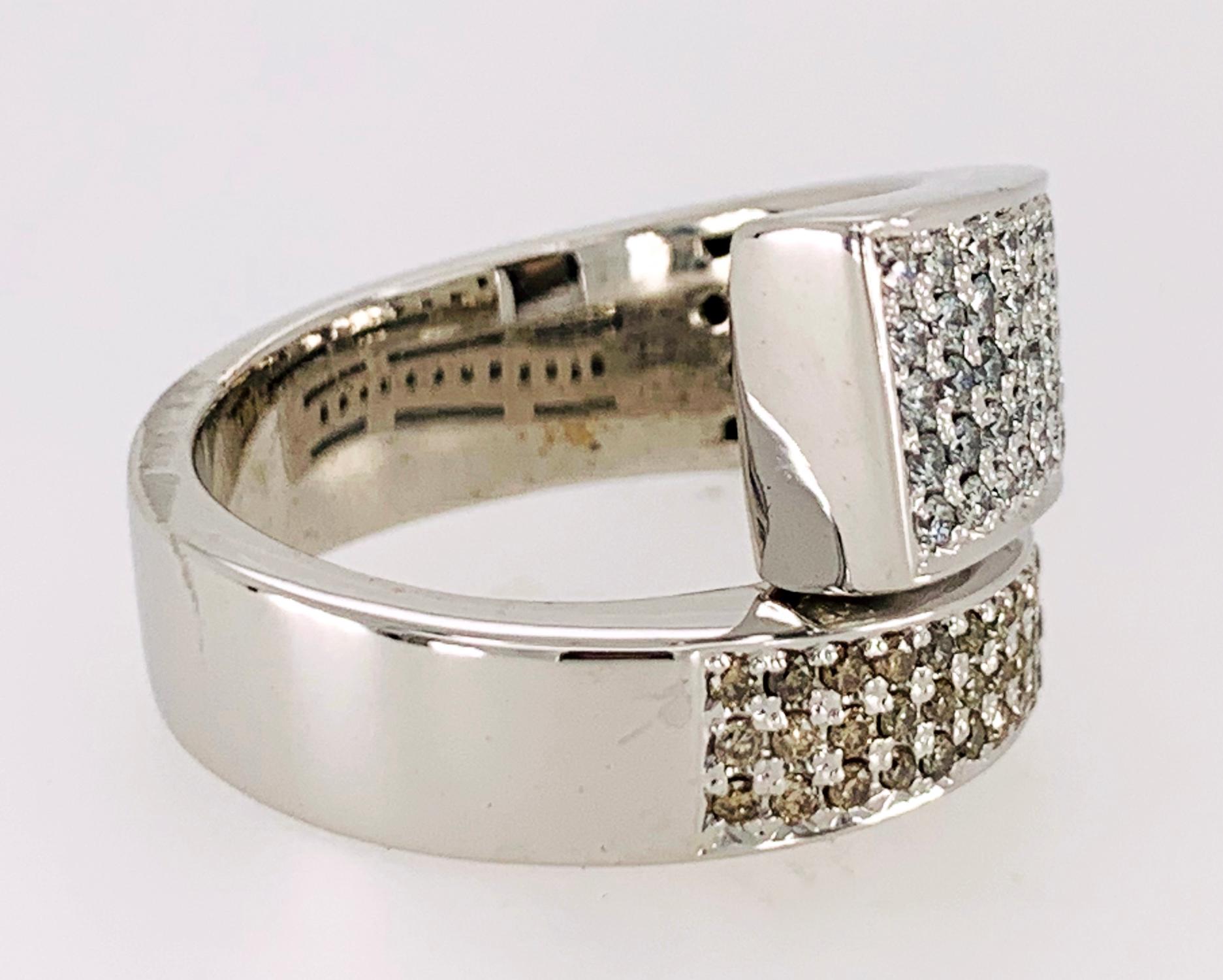 Diamond Ring in 18k white gold features approximately 1.41 carats of round brilliant, pave set diamonds, F~G in color, VS~SI1 in clarity.  Hallmark: '750'.  Size 7
15/16