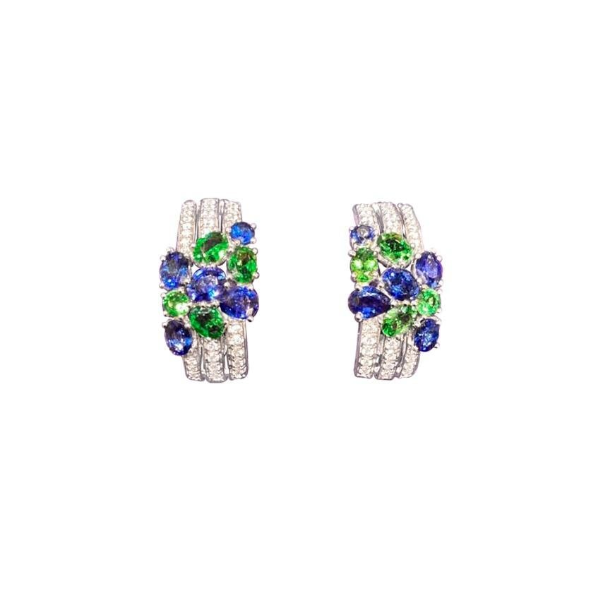 Earrings White Gold 14K  (Matching Ring Available)
Diamond 60-RND57-0,28-4/6A 
Blue Sapphire 2--RND-0,18 Т(4)/2A 
Blue Sapphire 6--Oval-1,16 Т(4)/3A 
Blue Sapphire 2-0,45 Т(4)/3A
Weight 7,39 grams

With a heritage of ancient fine Swiss jewelry