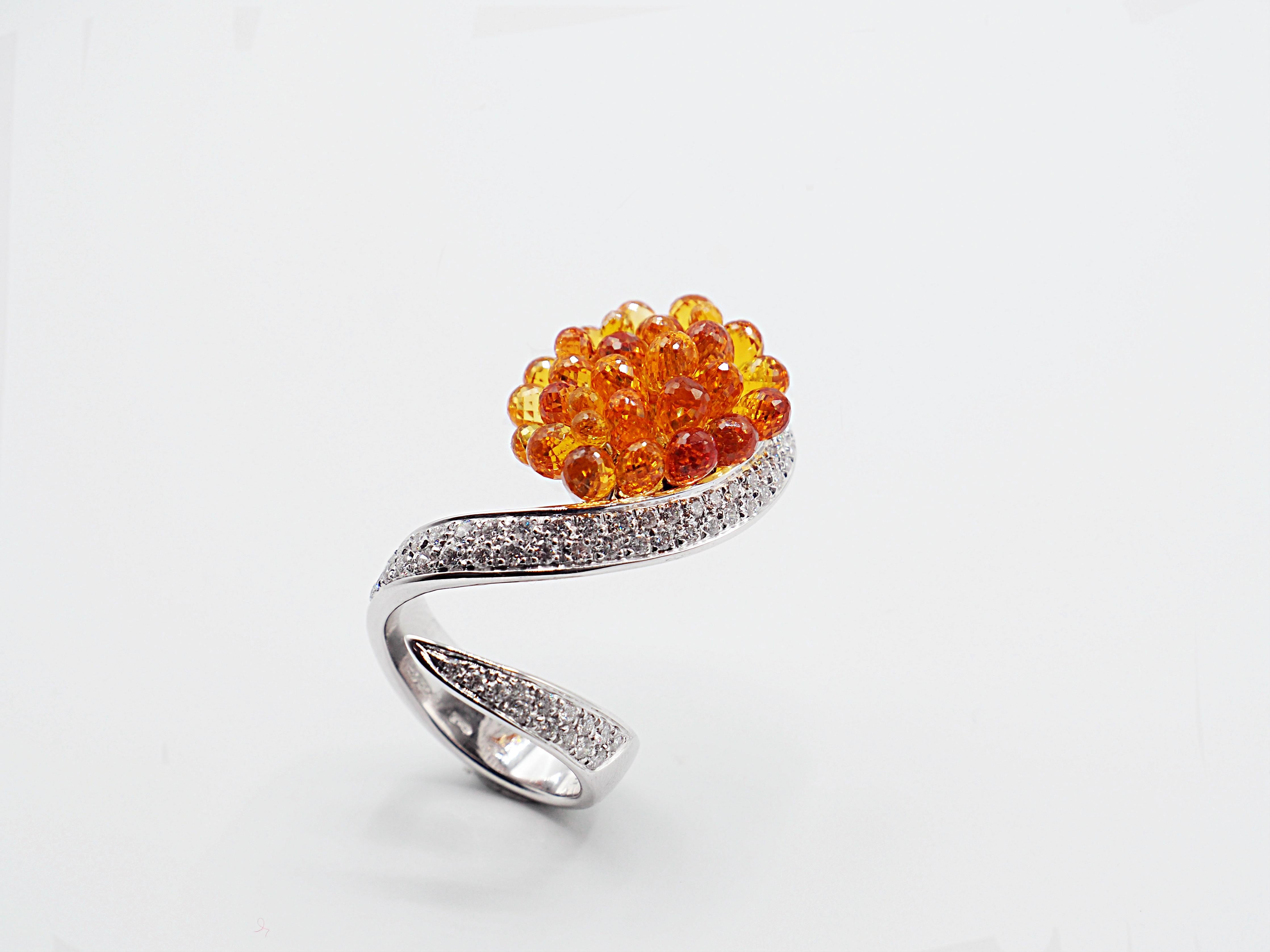 Bright briolette cut orange sapphires swing from an elegant structure in white gold, studded with a diamonds pave
Diamonds pave total ct. 1,43
Sapphires total ct. 20,87
Ring size: EU 16 (Resizable 2/3 sizes)