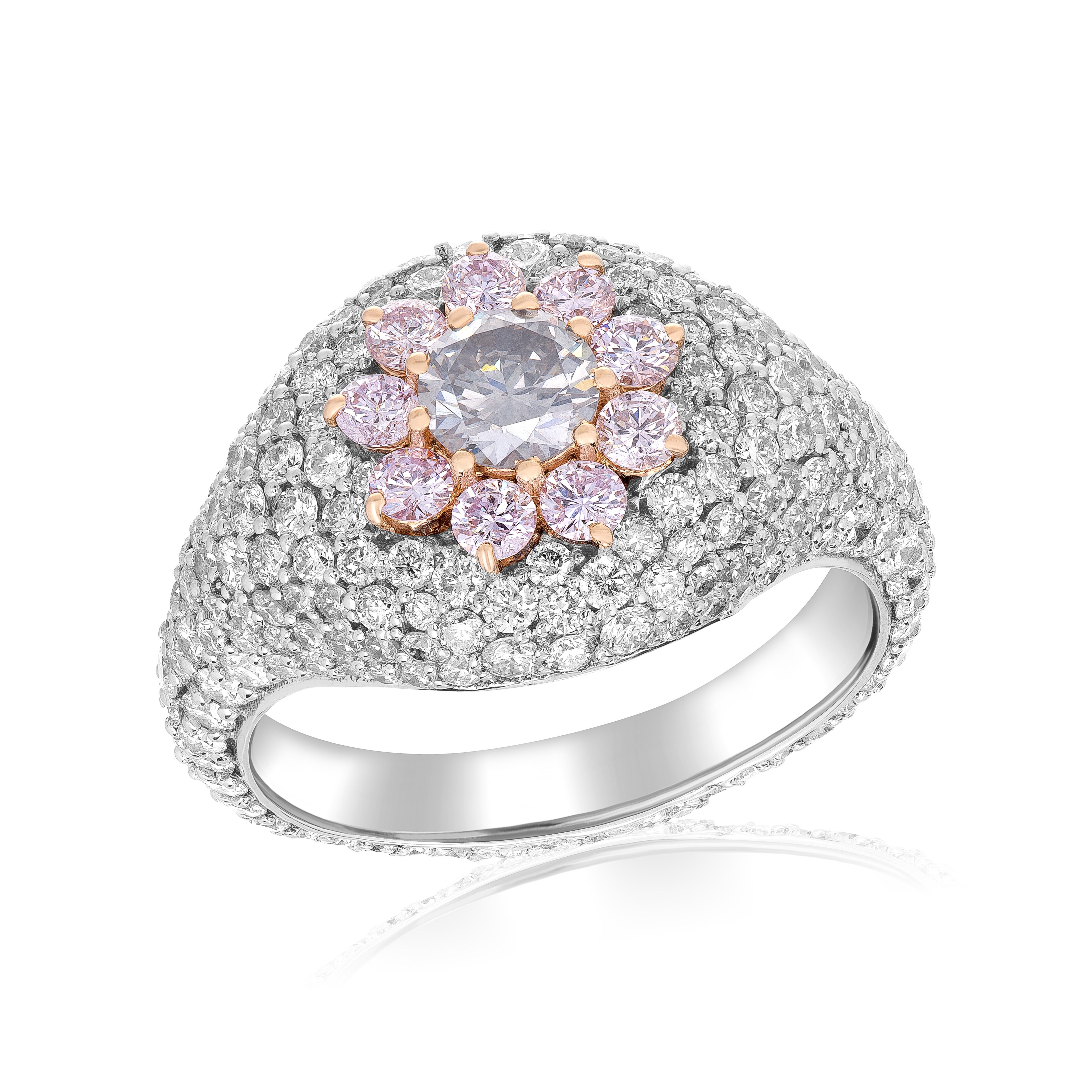 Make a statement with this stunning fashion ring that showcases a captivating fancy greyish green round diamond weighing 0.36 carats. The distinctive color of the diamond is beautifully complemented by 9 pink melee diamonds, totaling 0.36 carats,