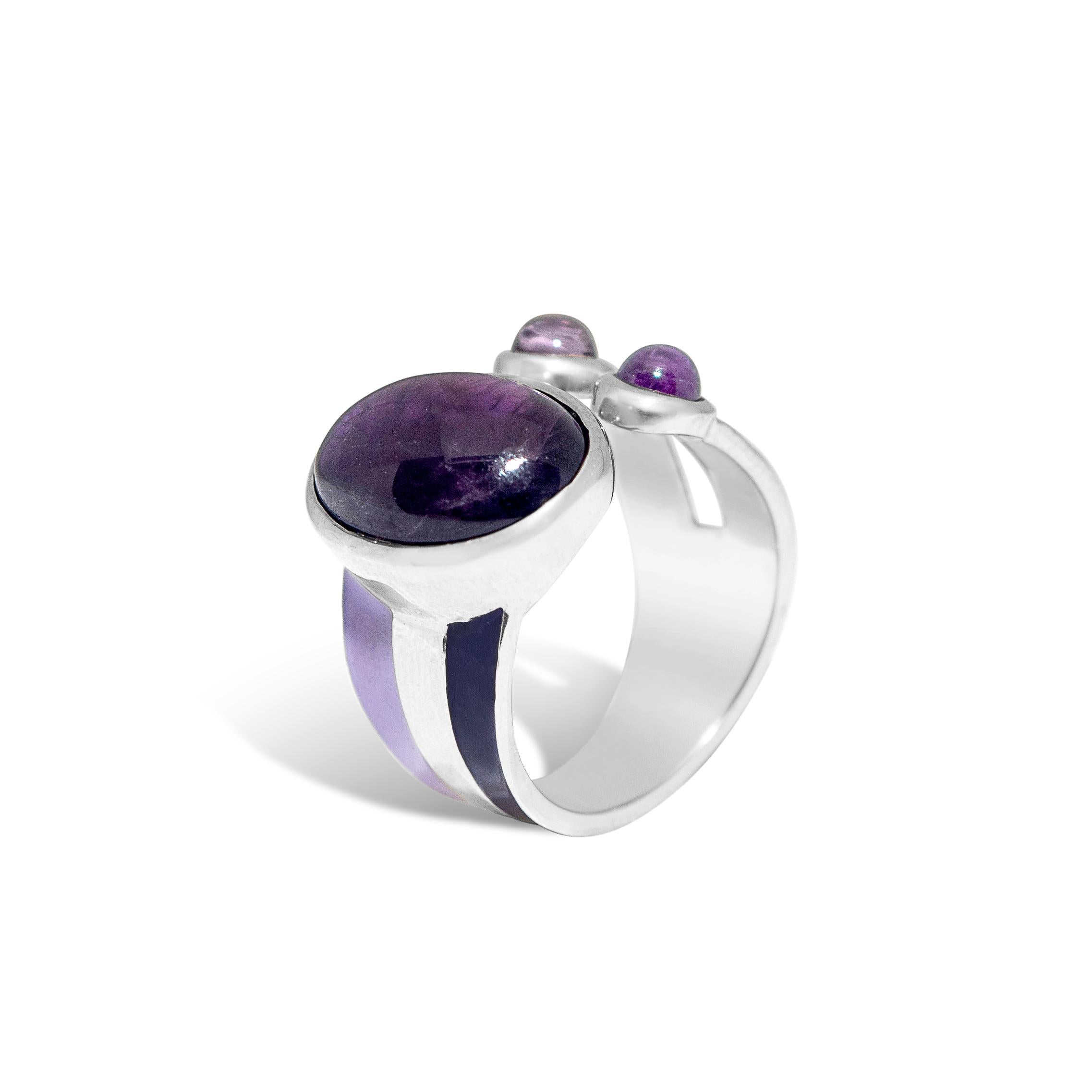 The Purple Striped Ring in polished sterling silver and enamel, set with lilac and deep violet tourmaline stones and amethyst
The design is inspired by the stripe pattern. We are all in love with stripes, so why not wearing striped jewellery