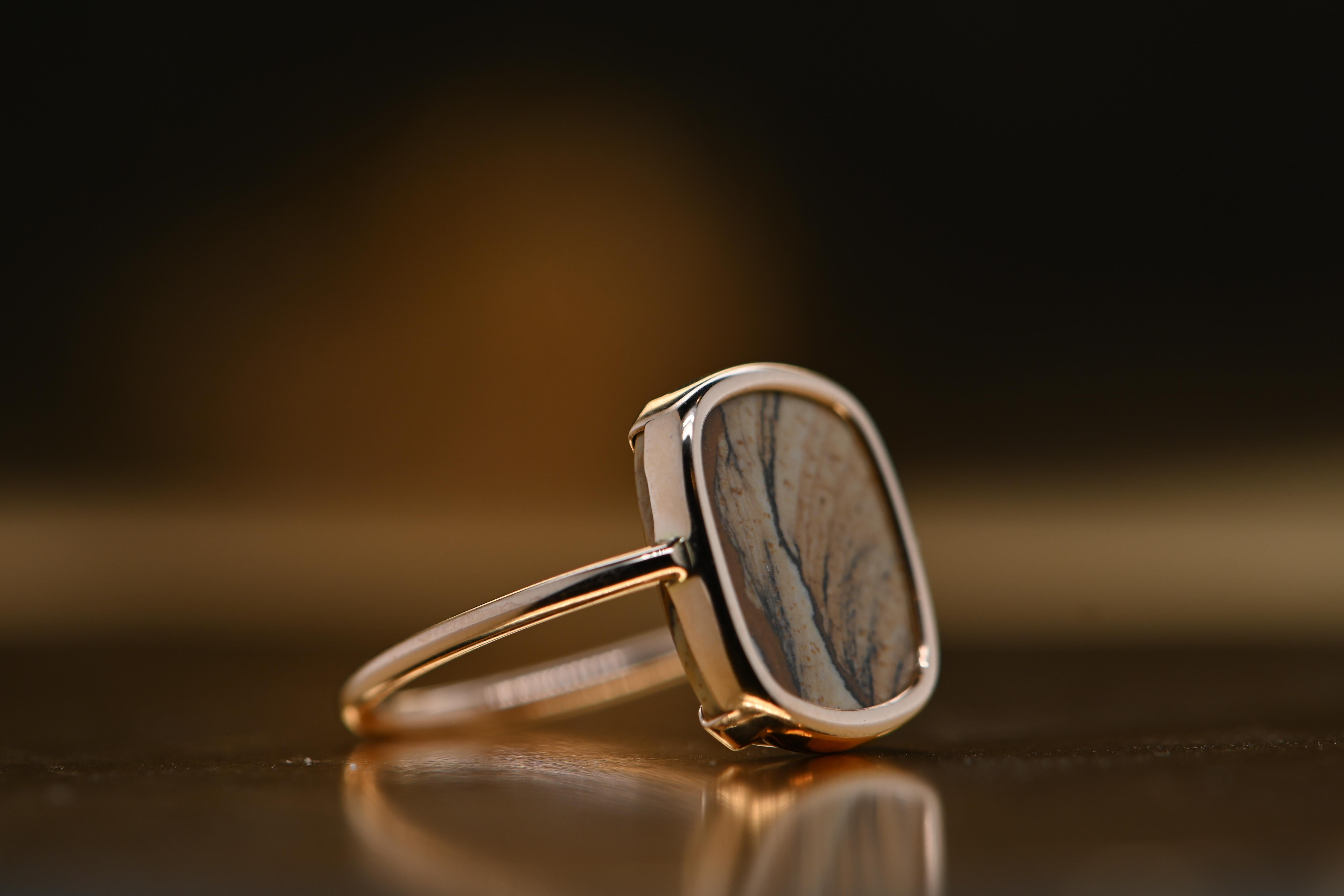 This elegant ring is crafted from 18 karat rose gold and set with a picture jasper measuring 14 x 12 mm. Jasper has been used since antiquity for its nearly magical properties and is renowned for its virtues of resilience and perseverance. This