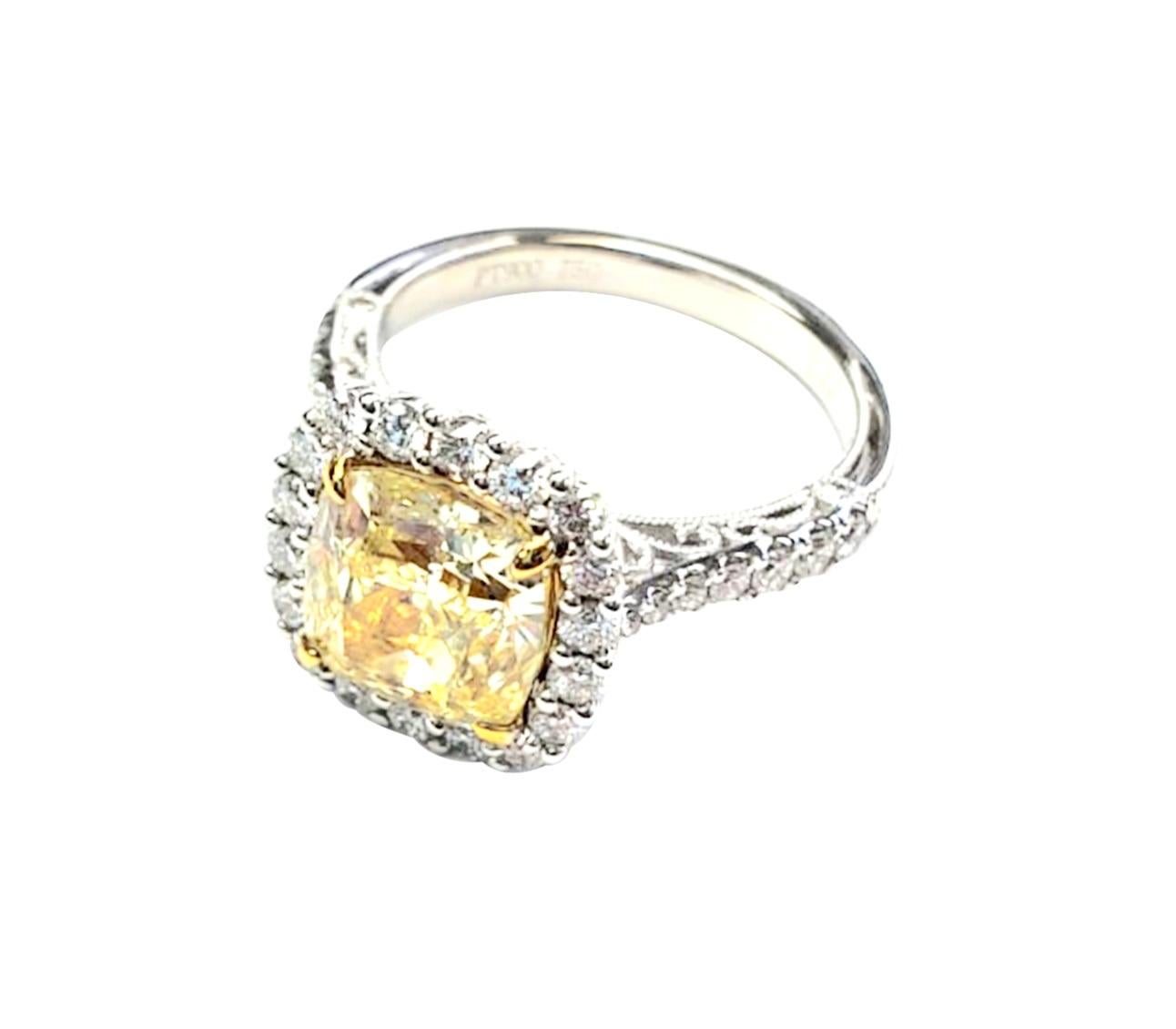 Cushion Yellow Diamond - 3.70ct

Round White Diamonds - 0.87ct

18k White Gold