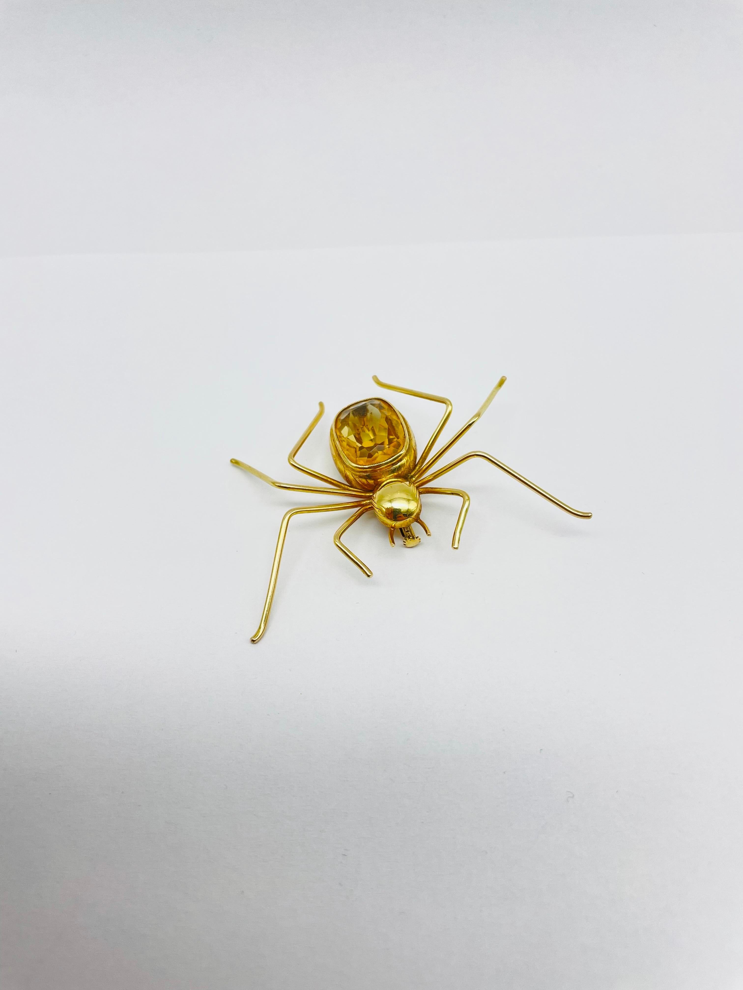 This brooch is a stunning example of the exquisite craftsmanship and timeless beauty that comes with owning a fine piece of jewelry.

Crafted from the highest quality 14k gold, this brooch features a delicately crafted spider with its legs spread