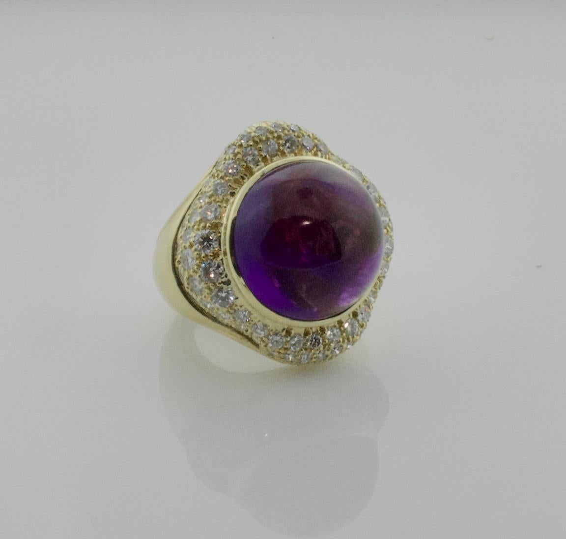 Fashionable Amethyst 37 carats and Diamond Ring in 18k with 2.60 in Diamonds
One Cabochon Cut Amethyst  weighing 37.00 carats approximately [bright with no imperfections visible to the naked eye]
Eighty Two Round Brilliant Cut Diamonds weighing 2.60