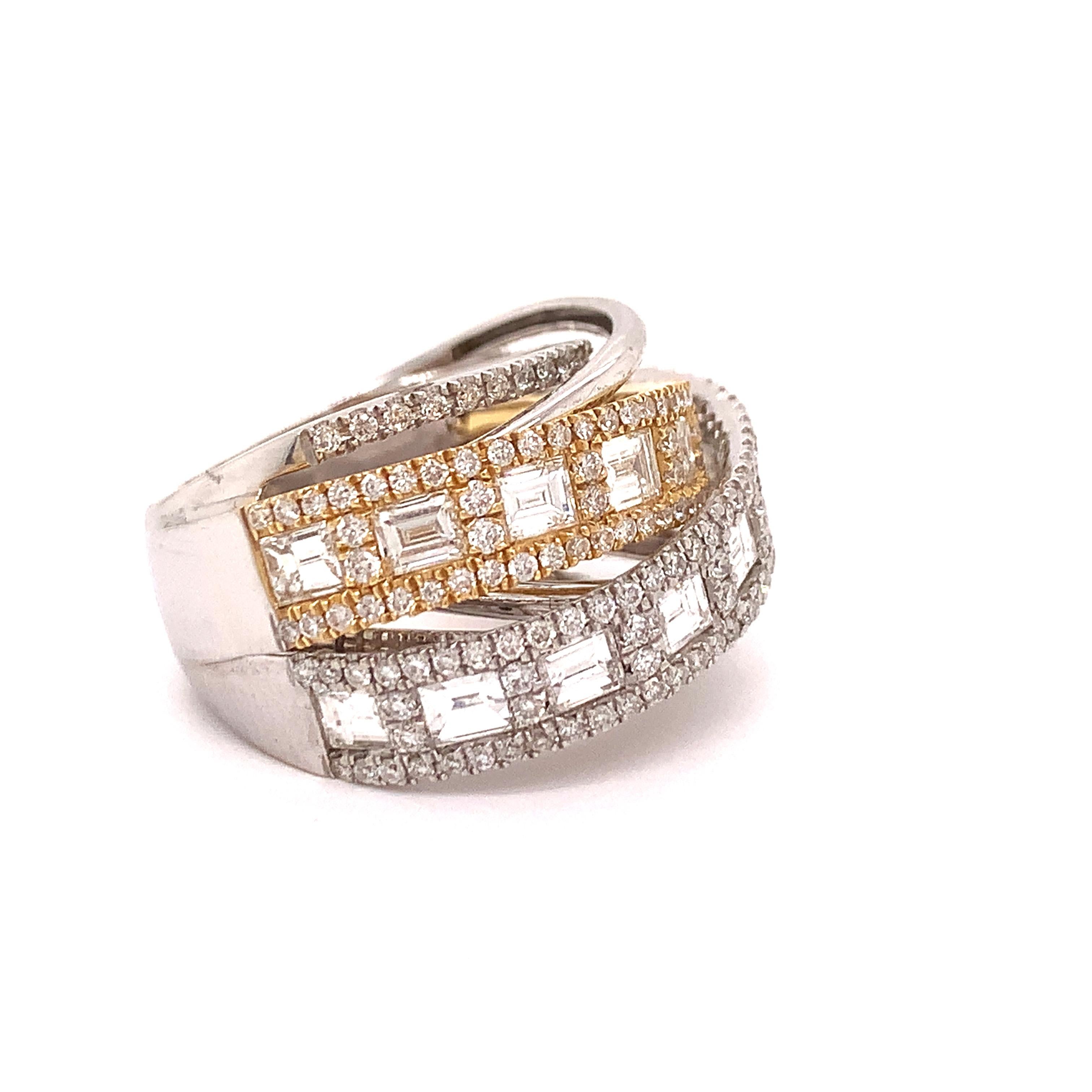 Superb combination of intertwining but stationary bands.  Delicate diamond bands in 18k white gold combined with wider bands in yellow and white gold with round and baguette diamonds. 1.11 cttw in round diamonds and 1.82 cttw in baguette.  A total