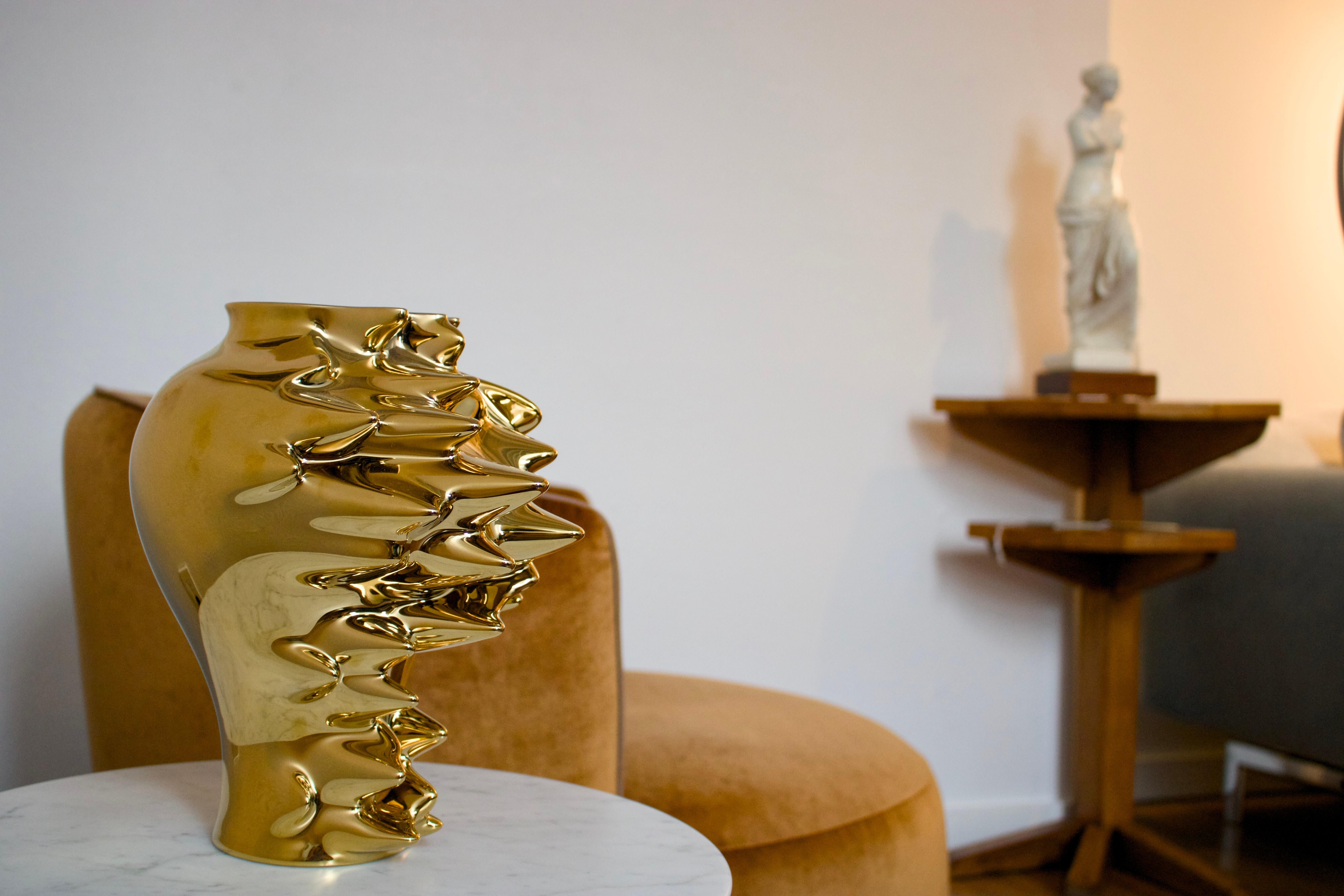 Cédric Ragot was an iconic designer that is only gaining more recognition with each passing year. “Fast,” created for Rosenthal, exemplifies his genius—a dynamic explosion frozen in time. The gold titanium alloy over white porcelain interior creates