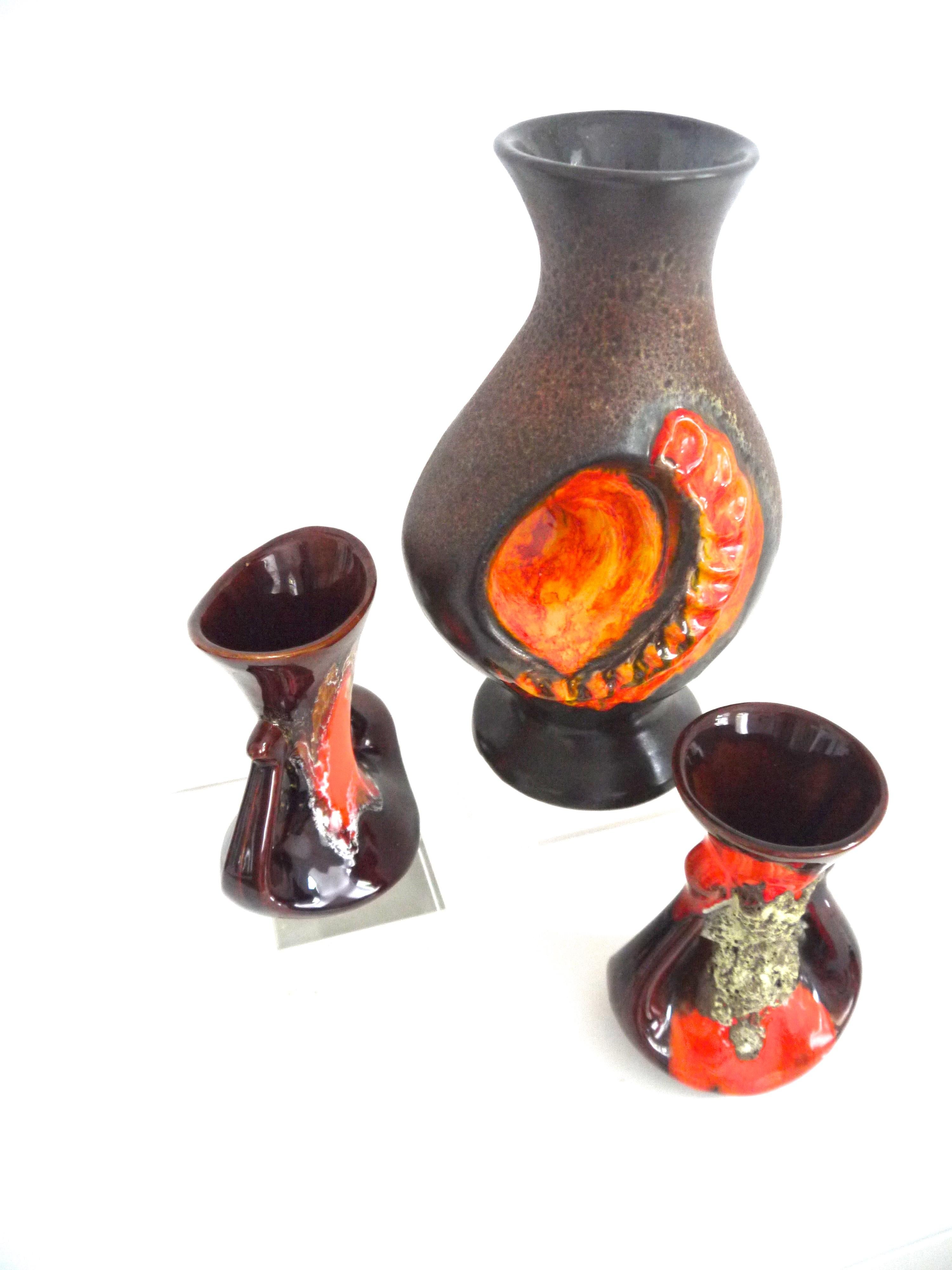 Fat Lava collection Walther Gerhards vase with two smaller pieces from Vallauris mid to late 1960s.
The first “lava”glaze appeared in 1967, coinciding with the sixties “summer of love”, so the bold colors, textures and vivid abstract styles were