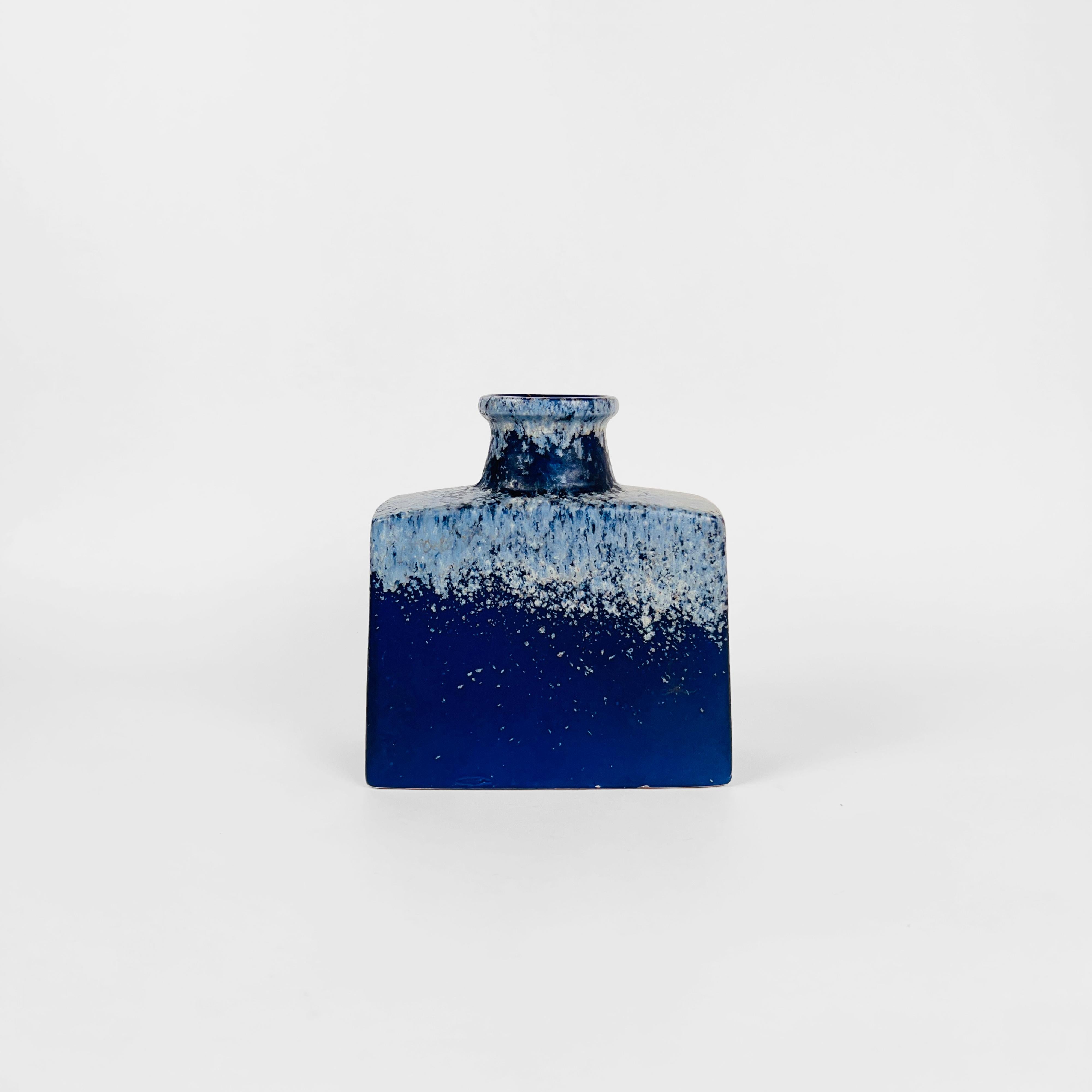 Rare shape fat lava studio vase. Finished in smooth Klein blue glaze with off white texture on the top part. Stamped 281-19 West Germany on the bottom.