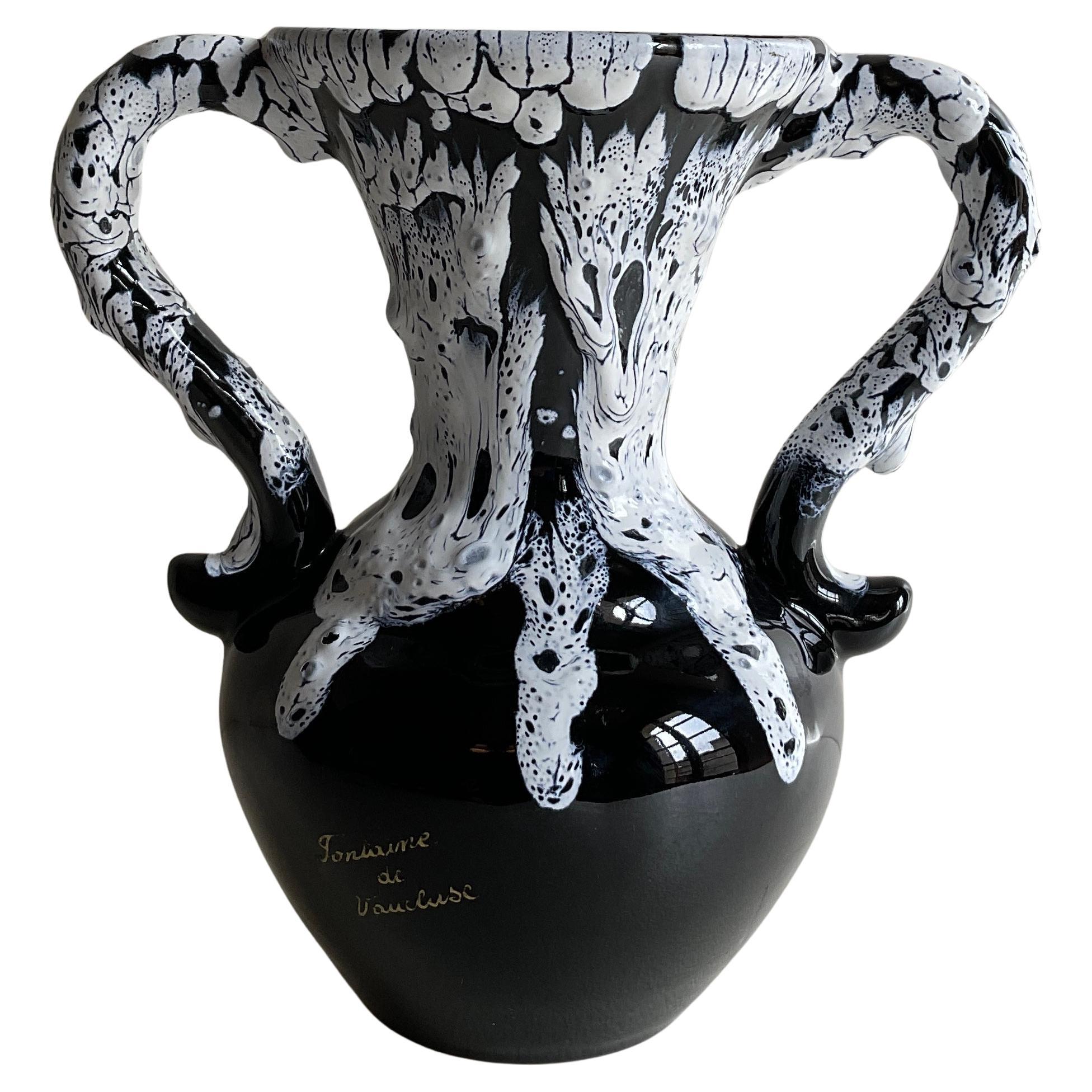 A good quality French Fat Lava style handled vase.

This stunning French Fat Lava style design and glazed finished piece will enhance any shelf or table top. 

Measures: 10 1/2