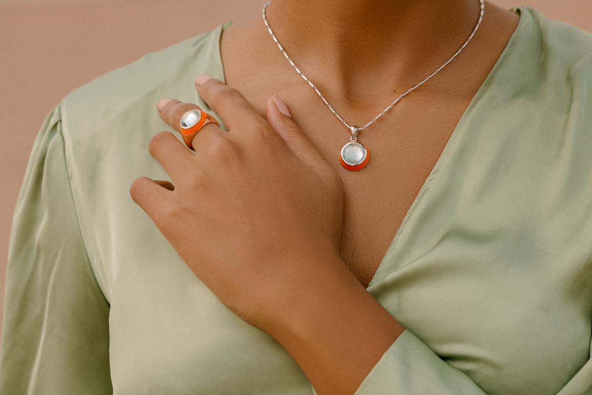 When you wear a gemstone ring on the right hand, it maximizes the energies of your inner world. If you wear it on the left hand, you are more linked to your imagination. 

Material: Rose Gold and Orange Enamel

Gemstones: Round Cabochon Sky Blue