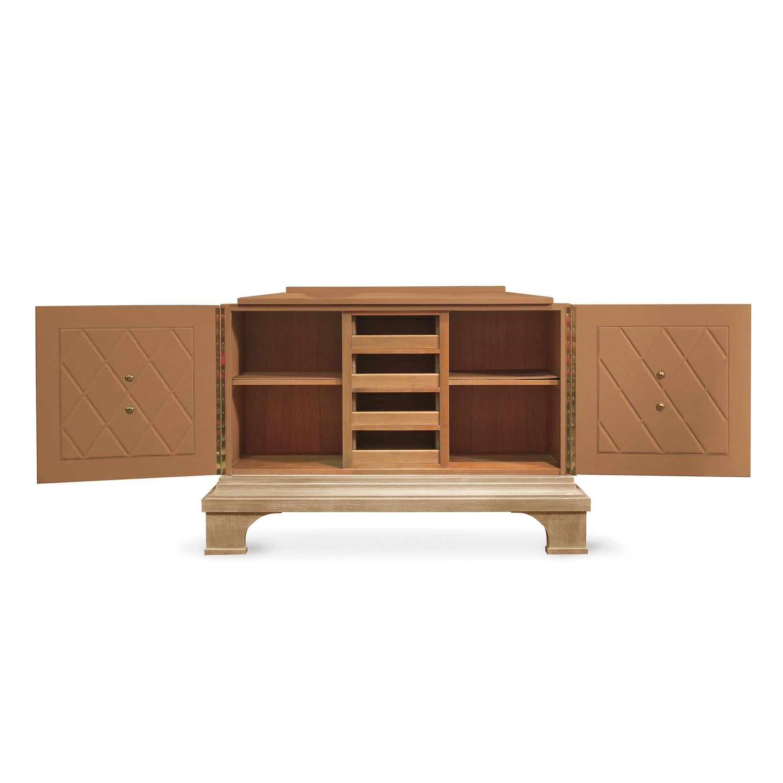 A stunning example of a traditional design reinvented with a modern flair, this sideboard is an exquisite object of functional decor that will complement a classically furnished home, making a sophisticated statement. Entirely handcrafted, this