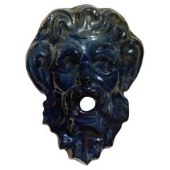 Faun mask in flamed sandstone from Rambervillers