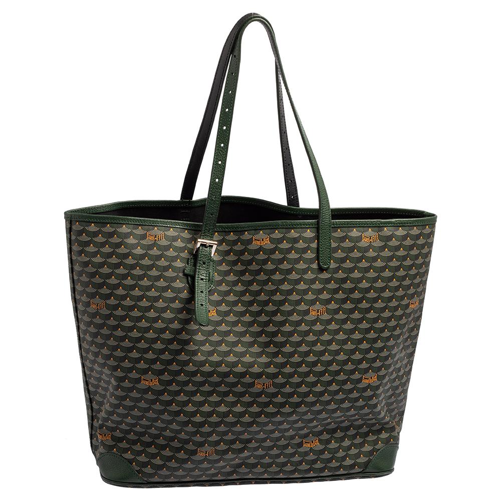This beautifully stitched coated canvas and leather tote is by Faure Le Page. With a capacious canvas-lined interior, it will house more than your essentials. Boasting two handles and a seamless finish, this tote offers style and utmost