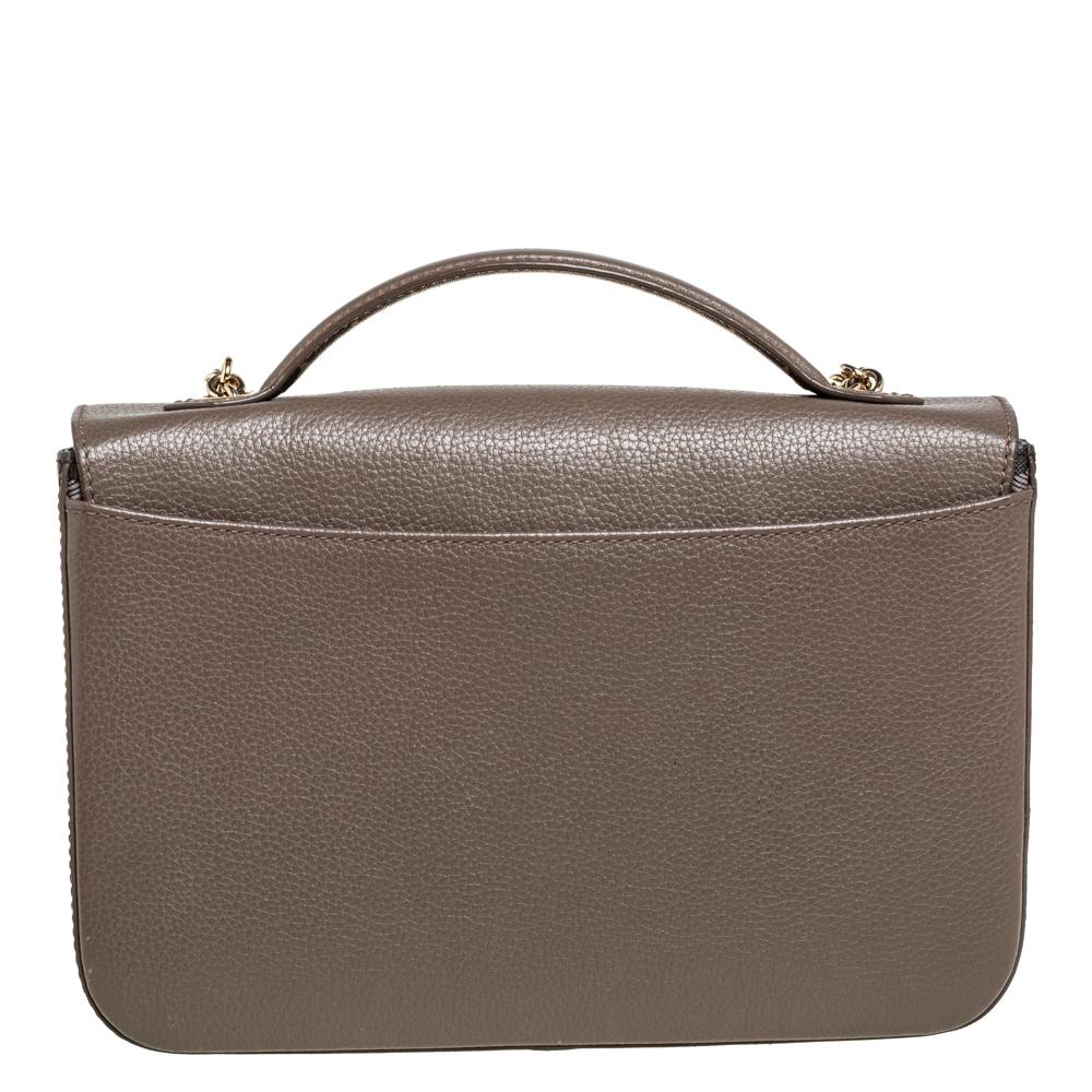 This uber-chic bag from Faure Le Page is crafted from leather and coated canvas. The bag features a shoulder chain, a top handle, and a fabric-lined interior that houses a well-sized compartment. Make an amazing appearance by adorning this gorgeous
