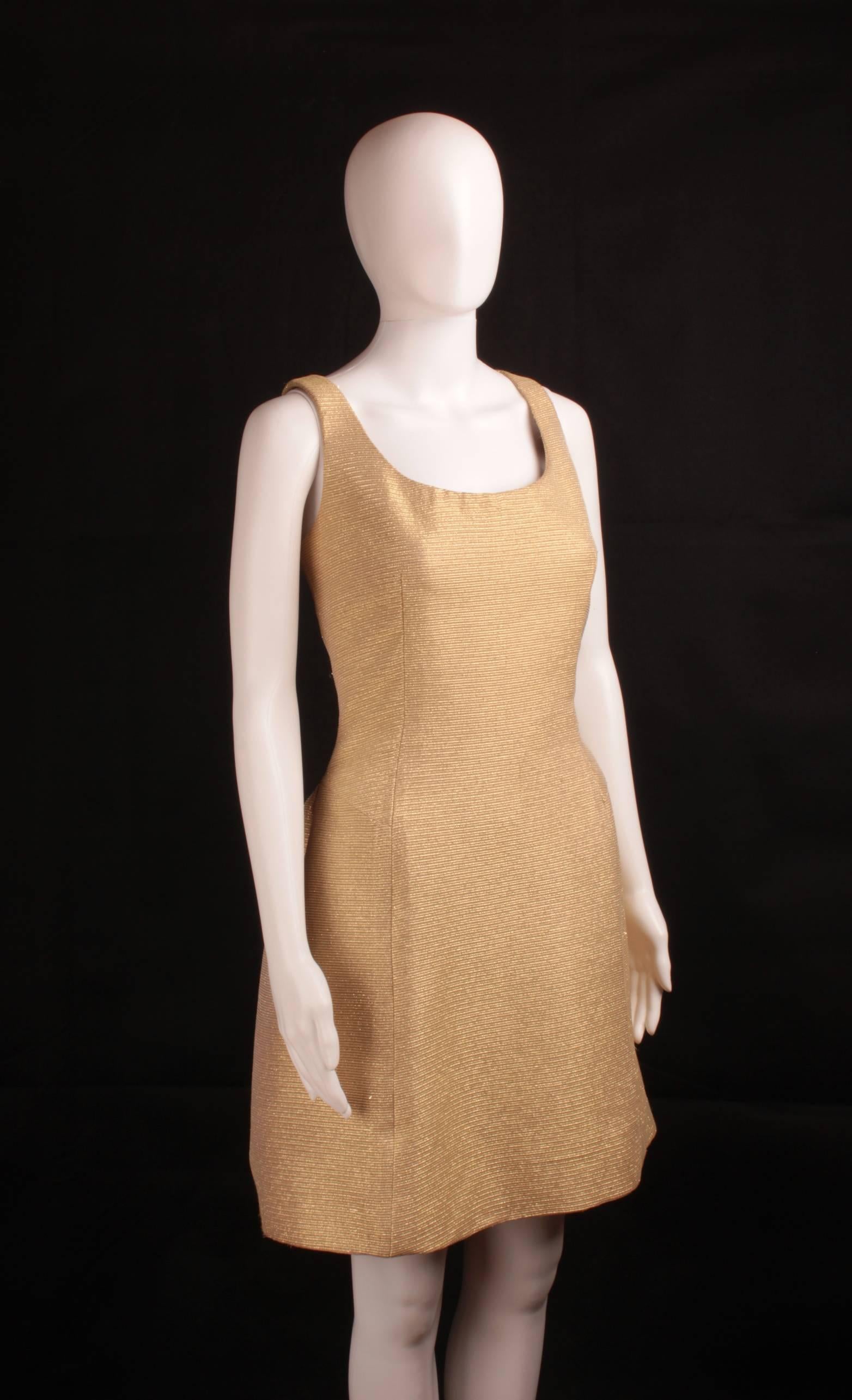 Brown mink fur on collar and cuffs. Beautiful big decorative closing key in golden metal with encrusted strass and four snap buttons. Dress is sleeveless.
Mint condition. Measurements take with the garment flat: 
(Jacket )shoulders width: 45 cm ,